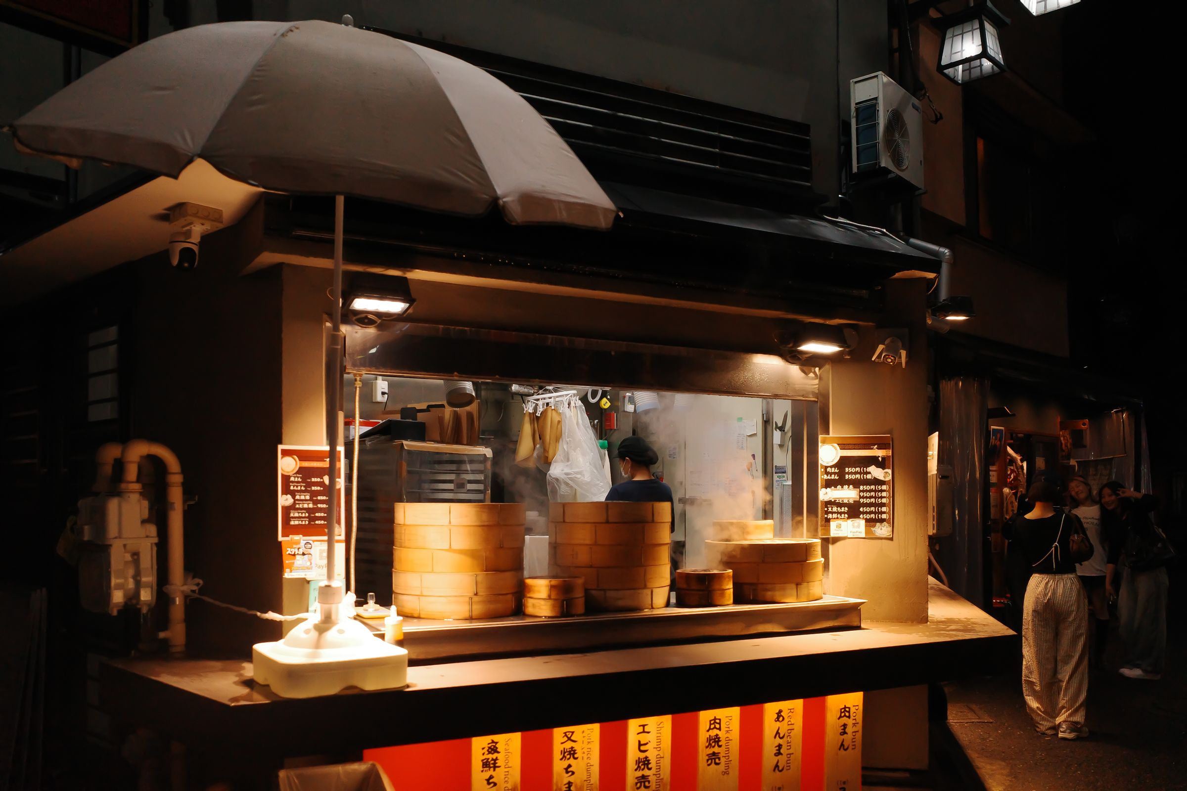 A dumpling stall at night in Tokyo, shot on the Ricoh GR III