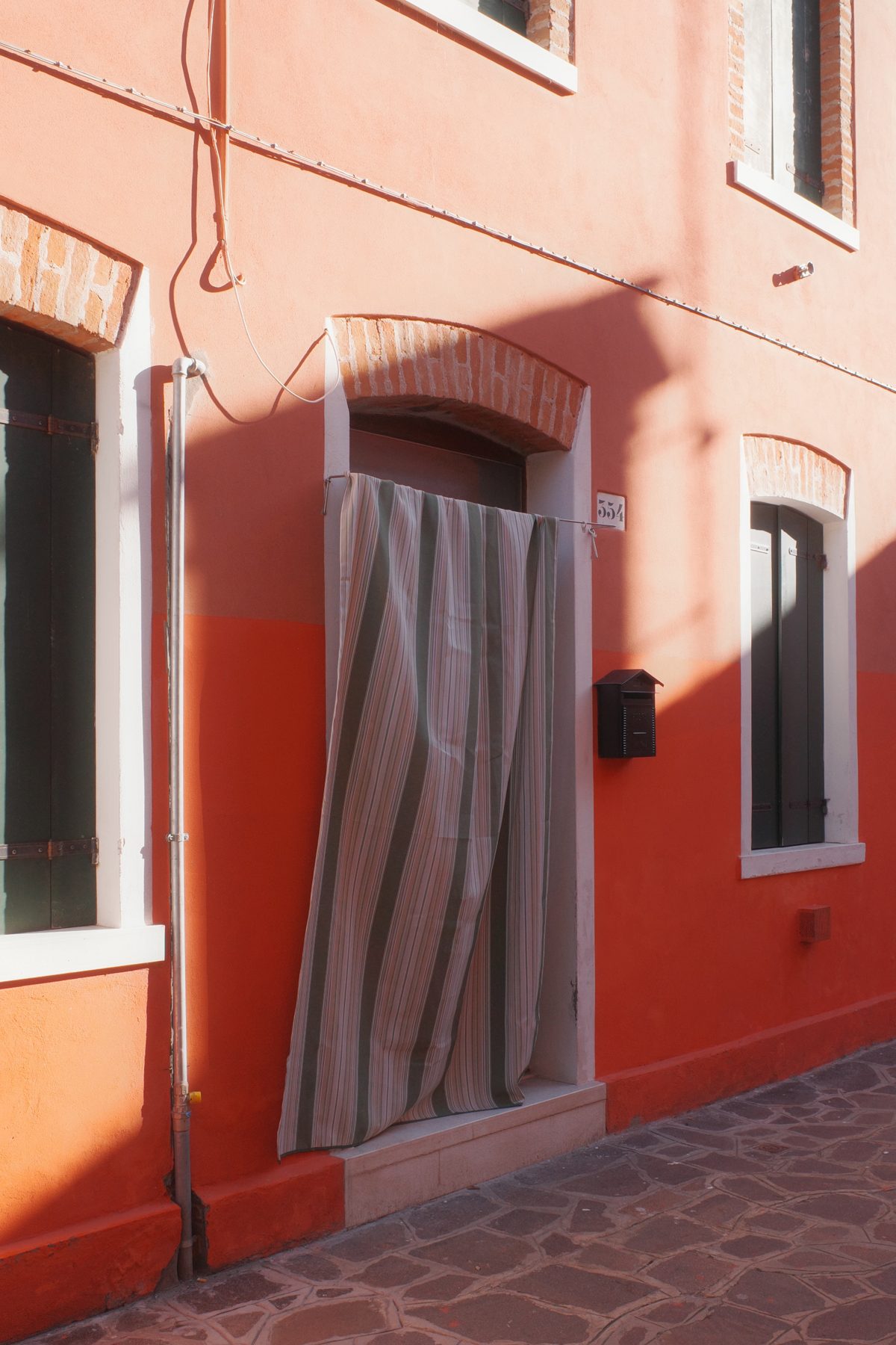 A red curtain in a doorway