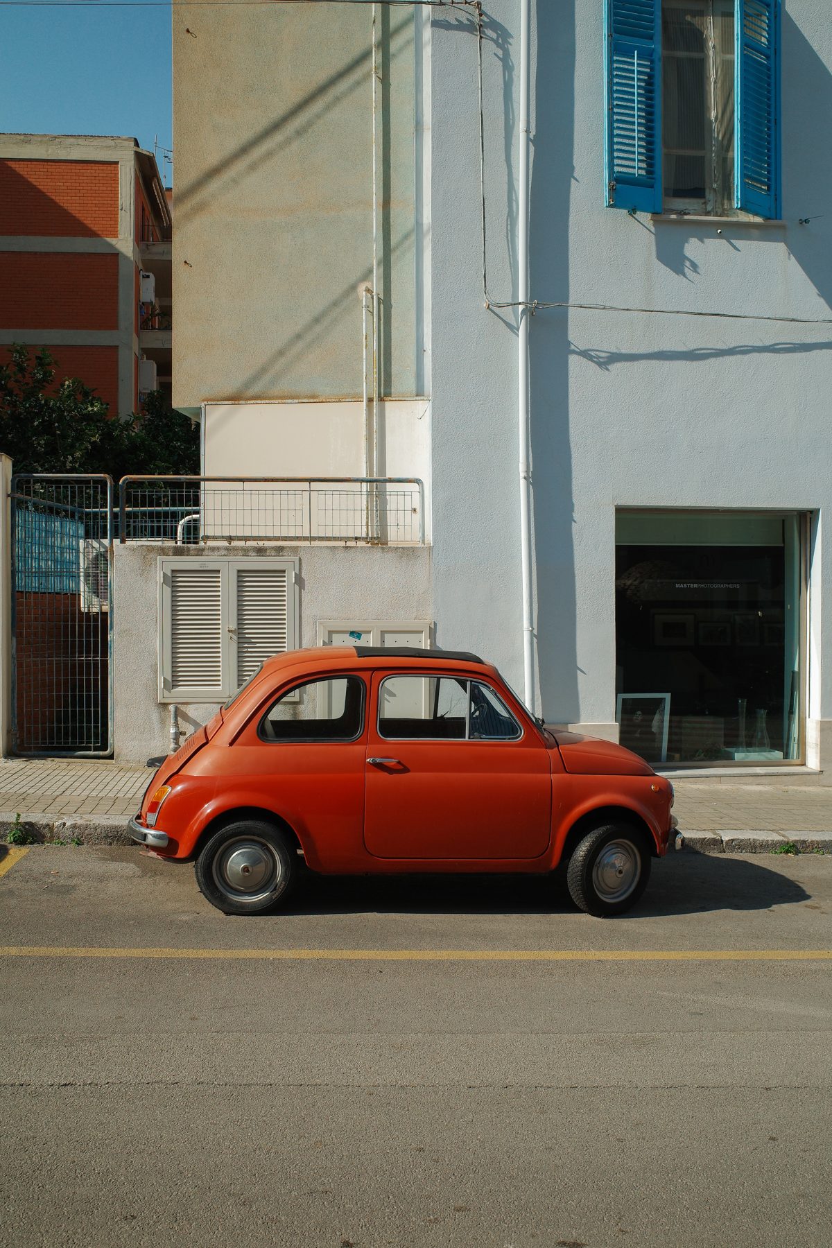 A red Fiat in the street