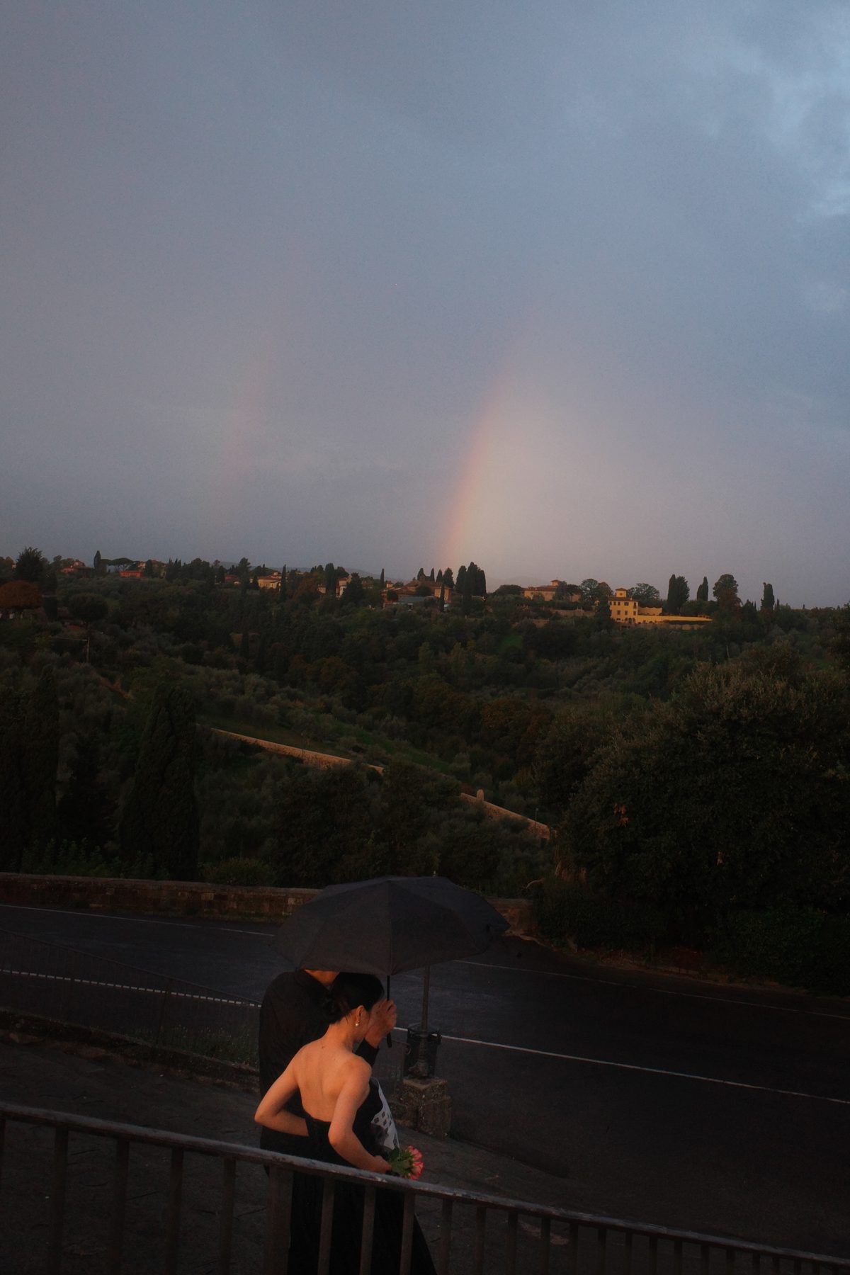 A rainbow over the city at sunrise