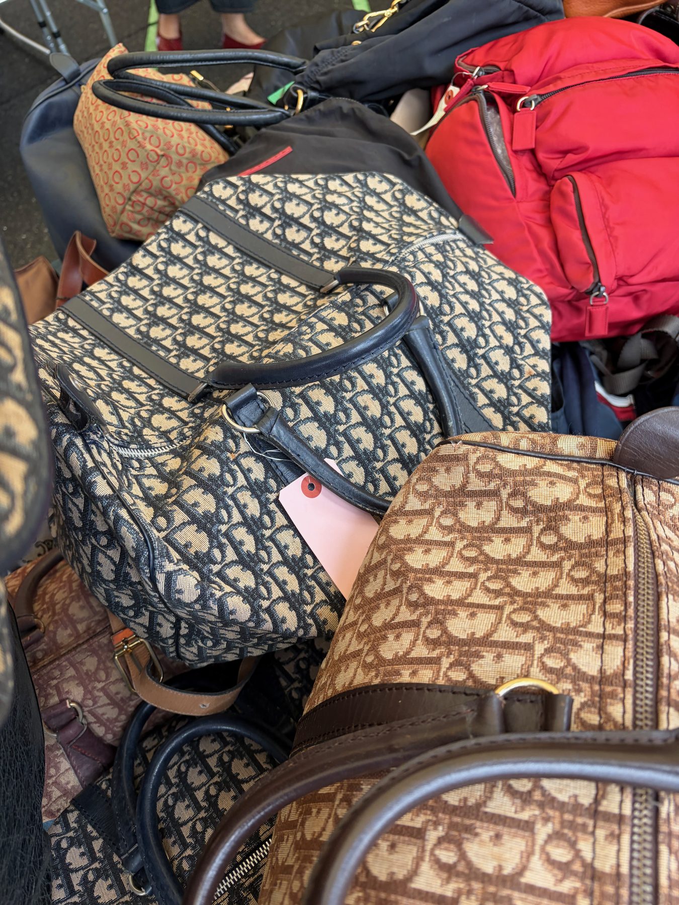 A pile of Dior bags