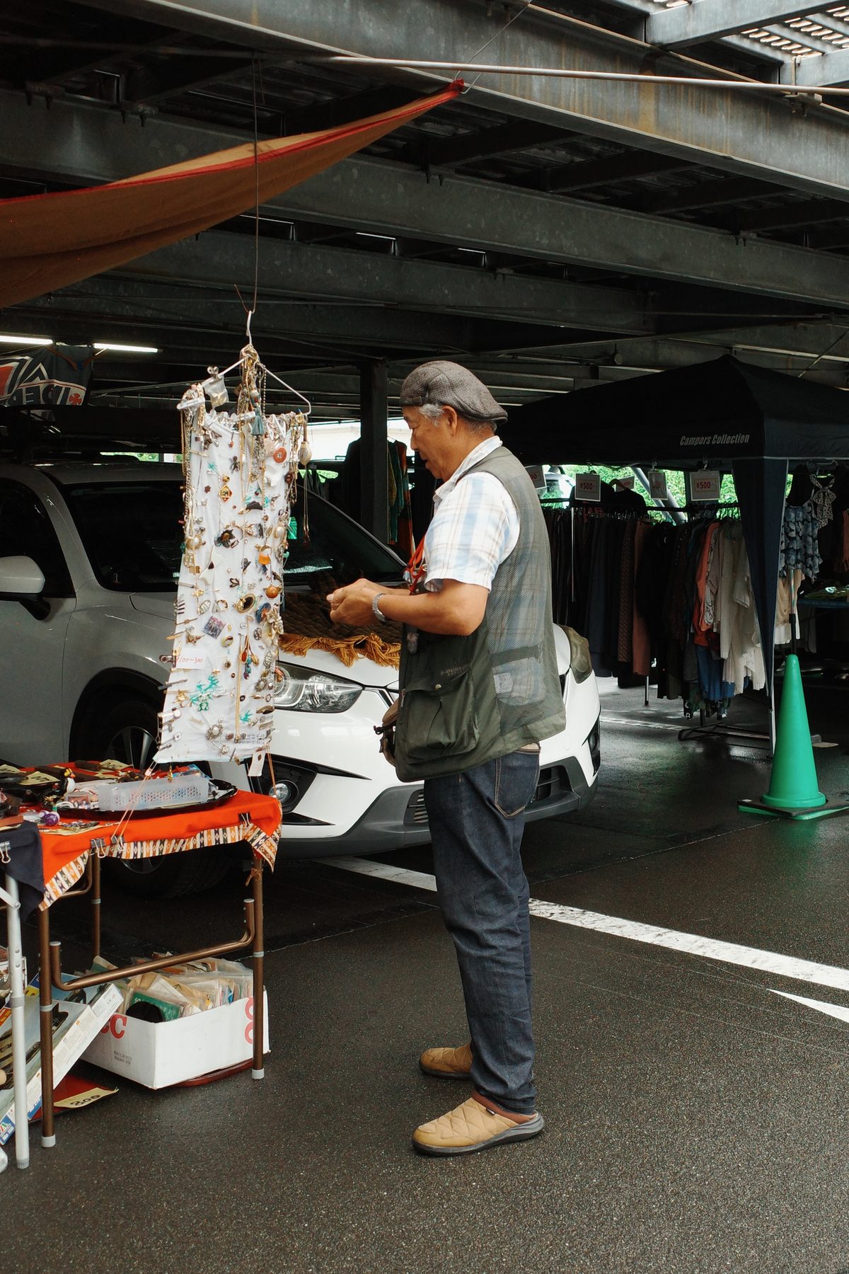 A seller with a dress on a hanger