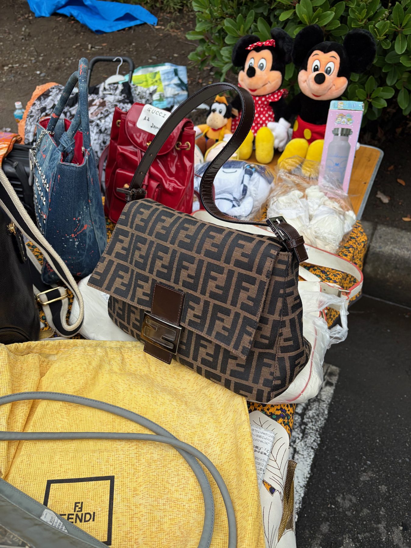 A Fendi bag and Mickey plush toys