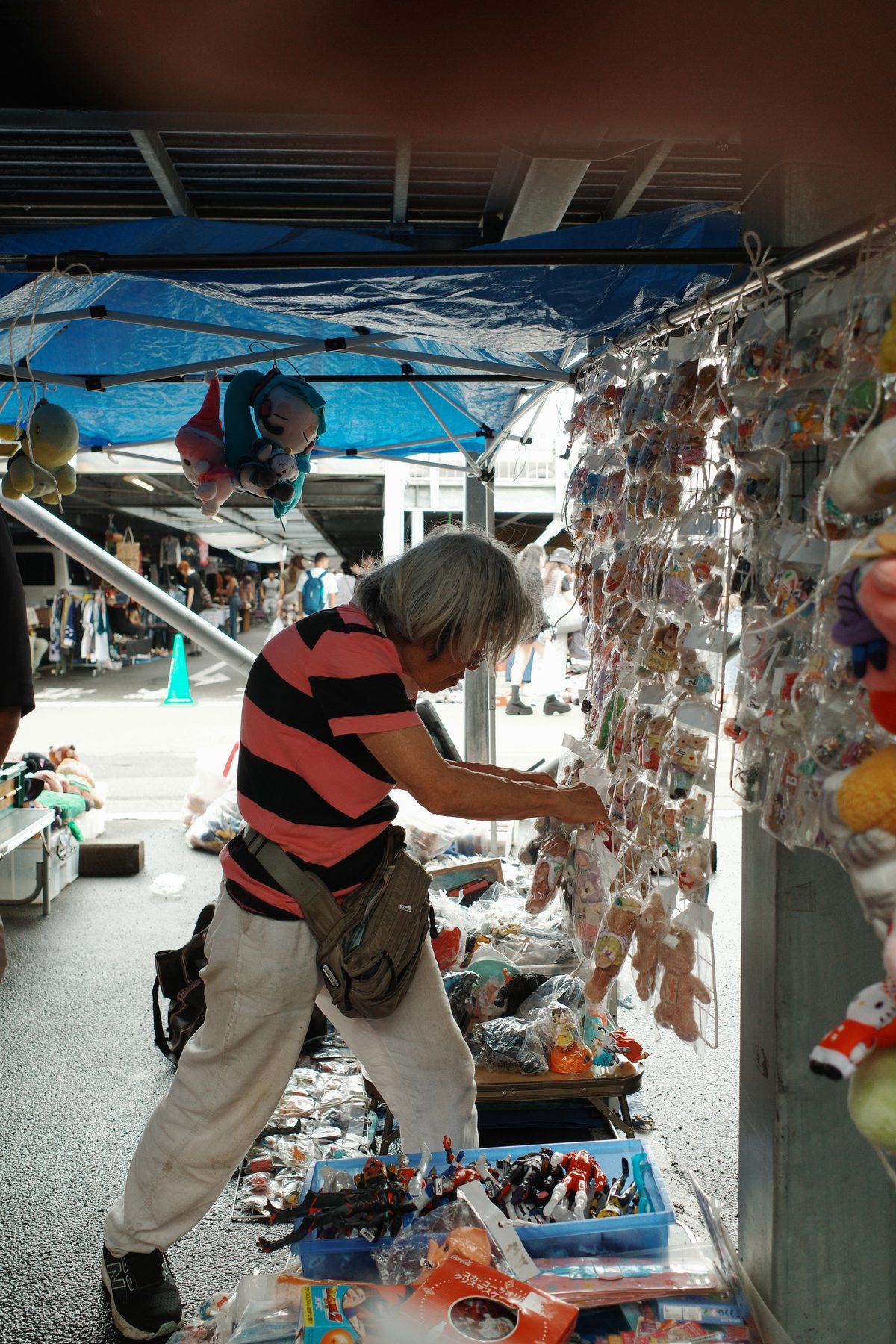 A woman looking at keyrings