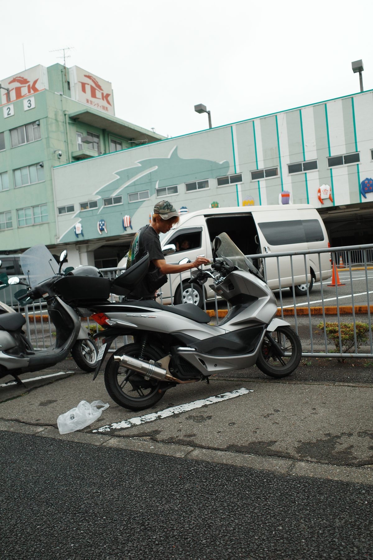Scooters parked by the racecourse