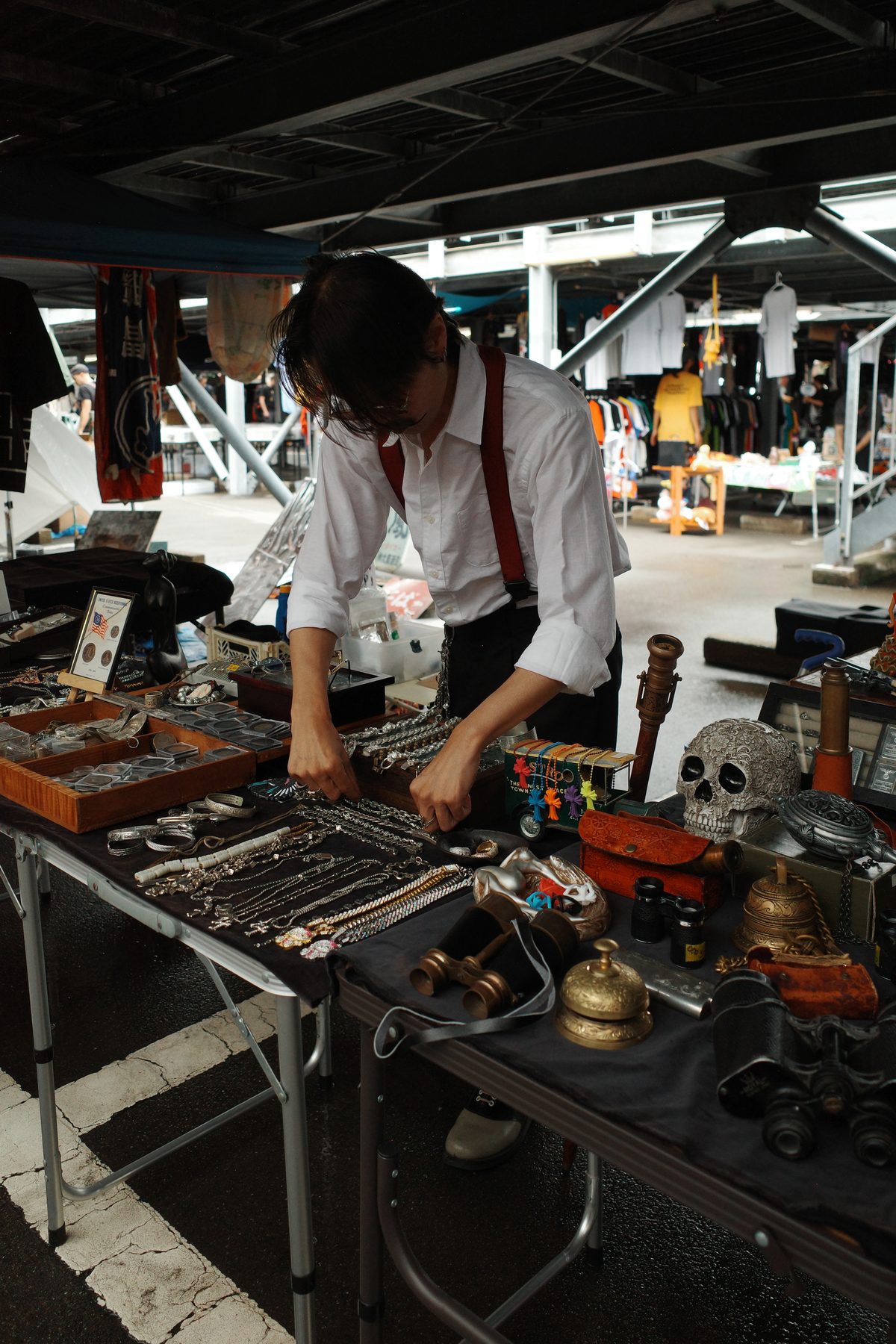 A seller with old watches and a skull