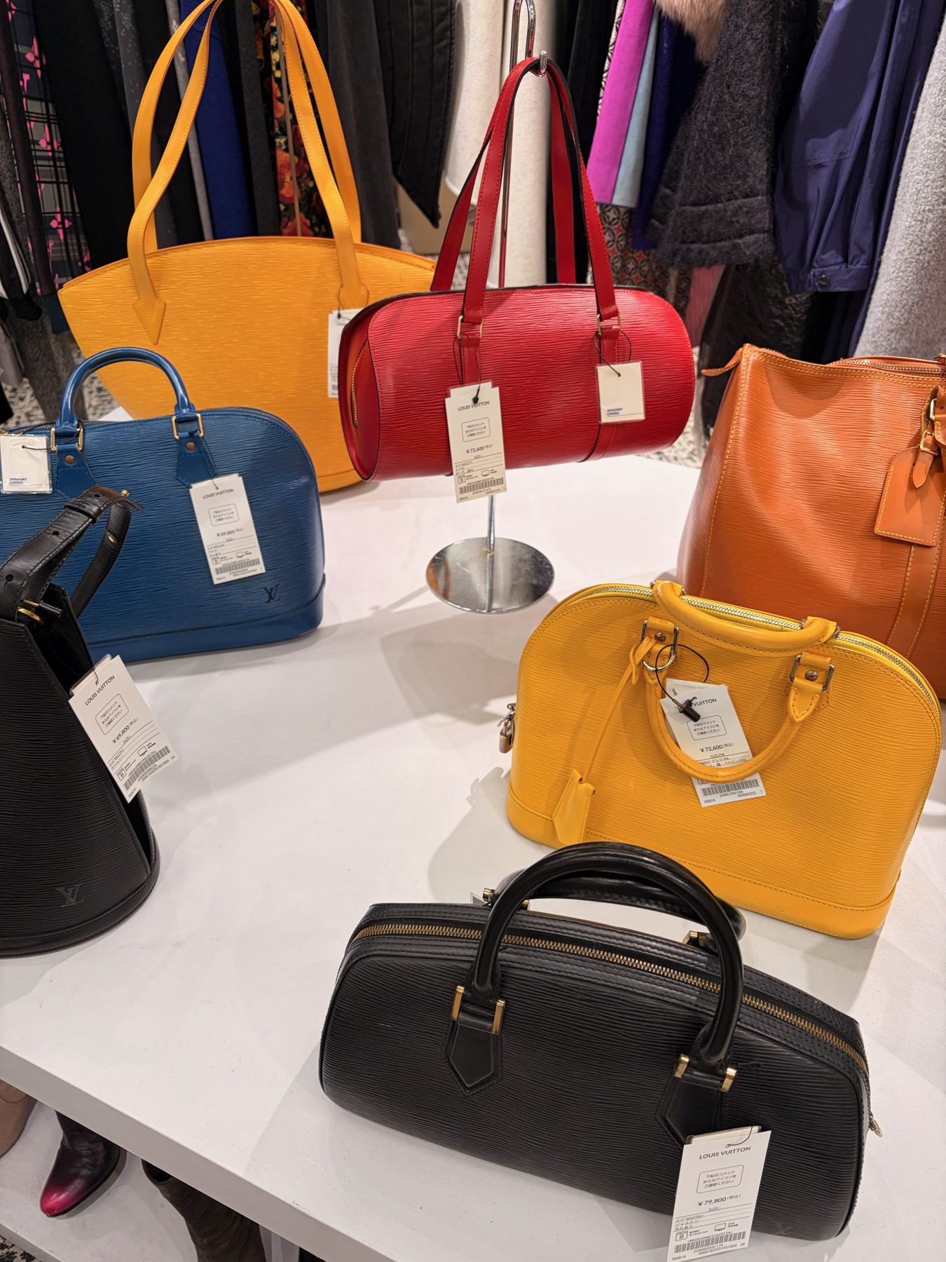 A wall of second hand bags