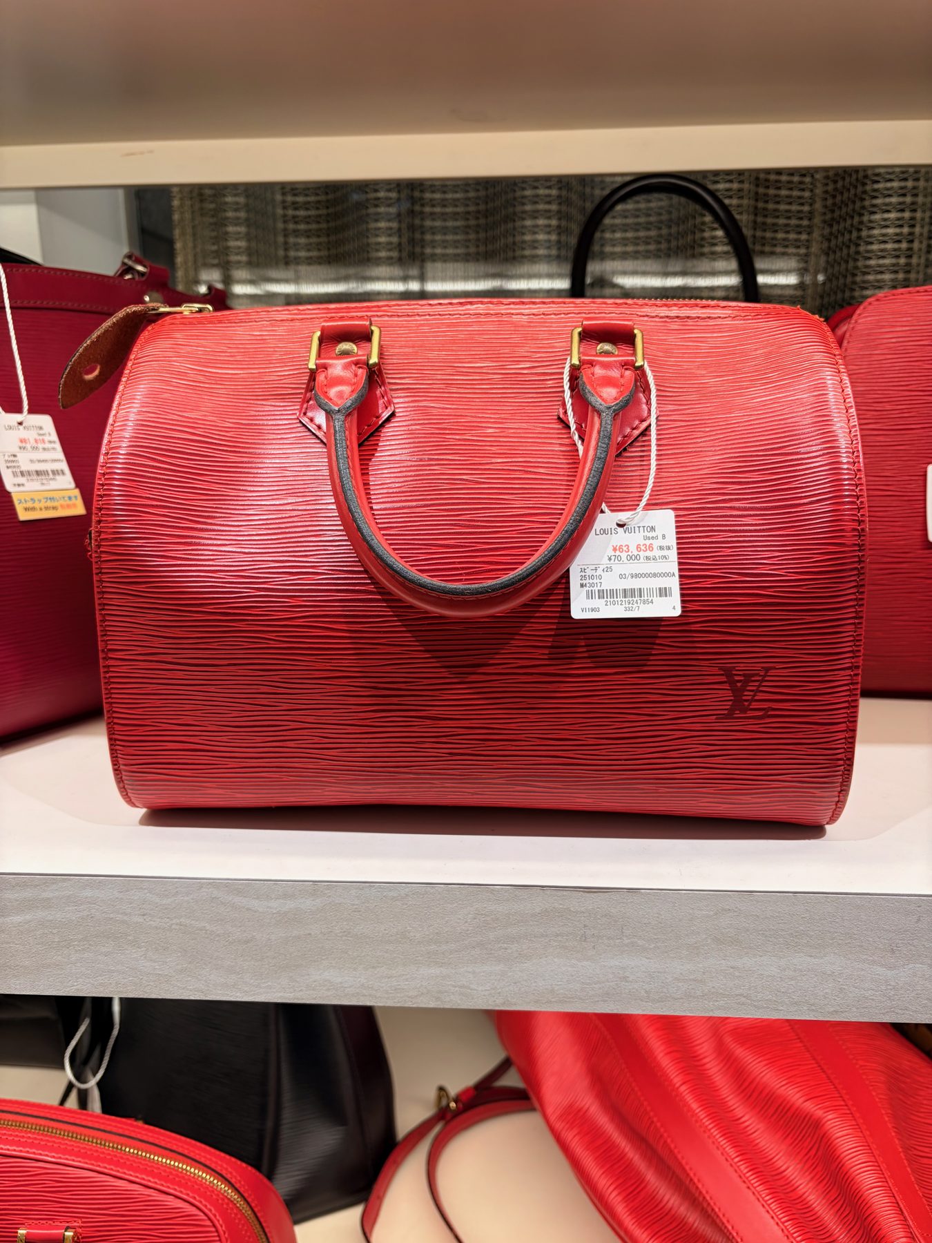 A Louis Vuitton Speedy in red Epi
