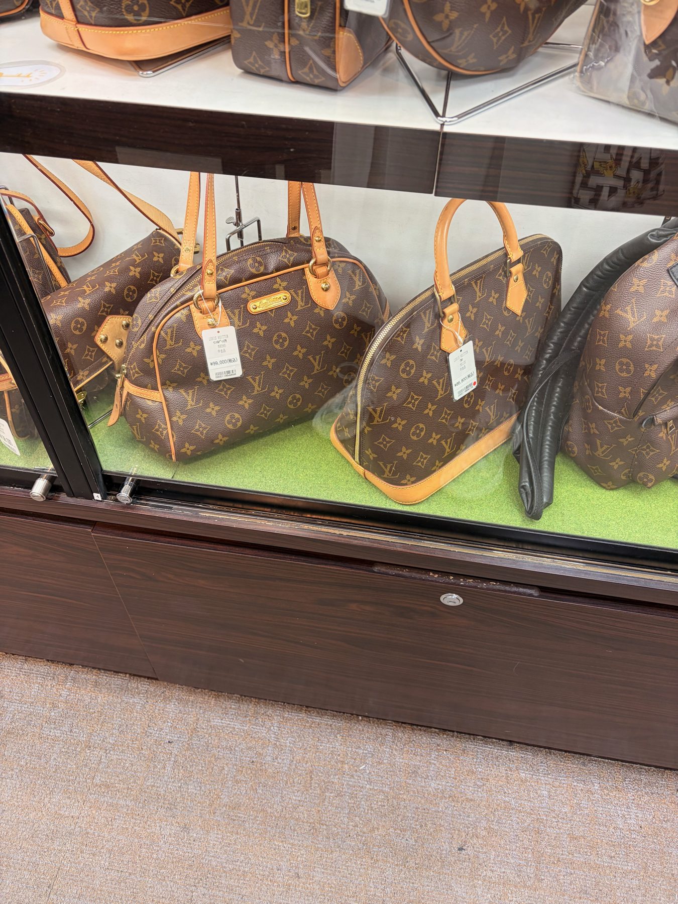 Monogram bags on a shelf