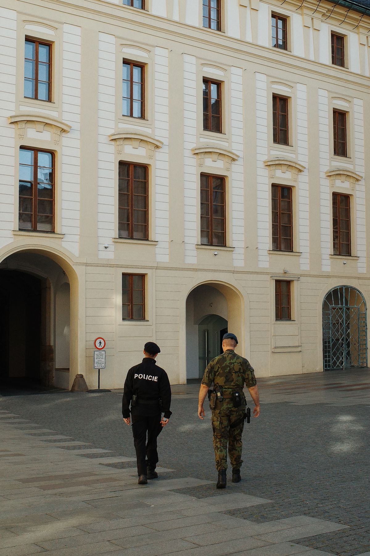 Two guards crossing the square