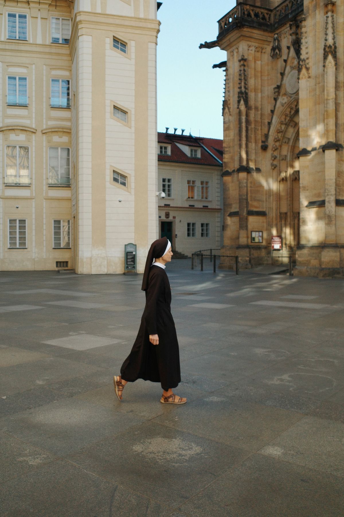 A nun crossing the castle square