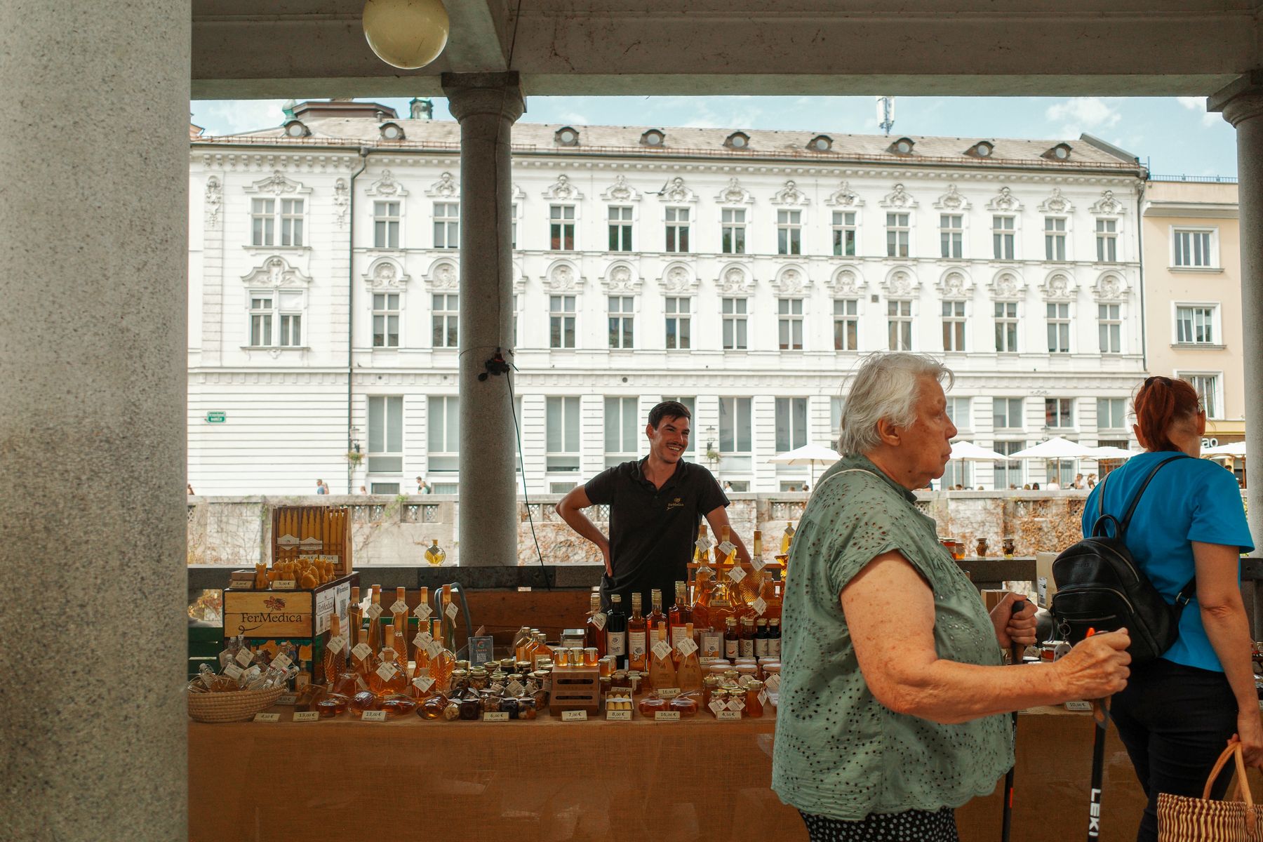 A honey and liqueur stall under Plečnik's arcades