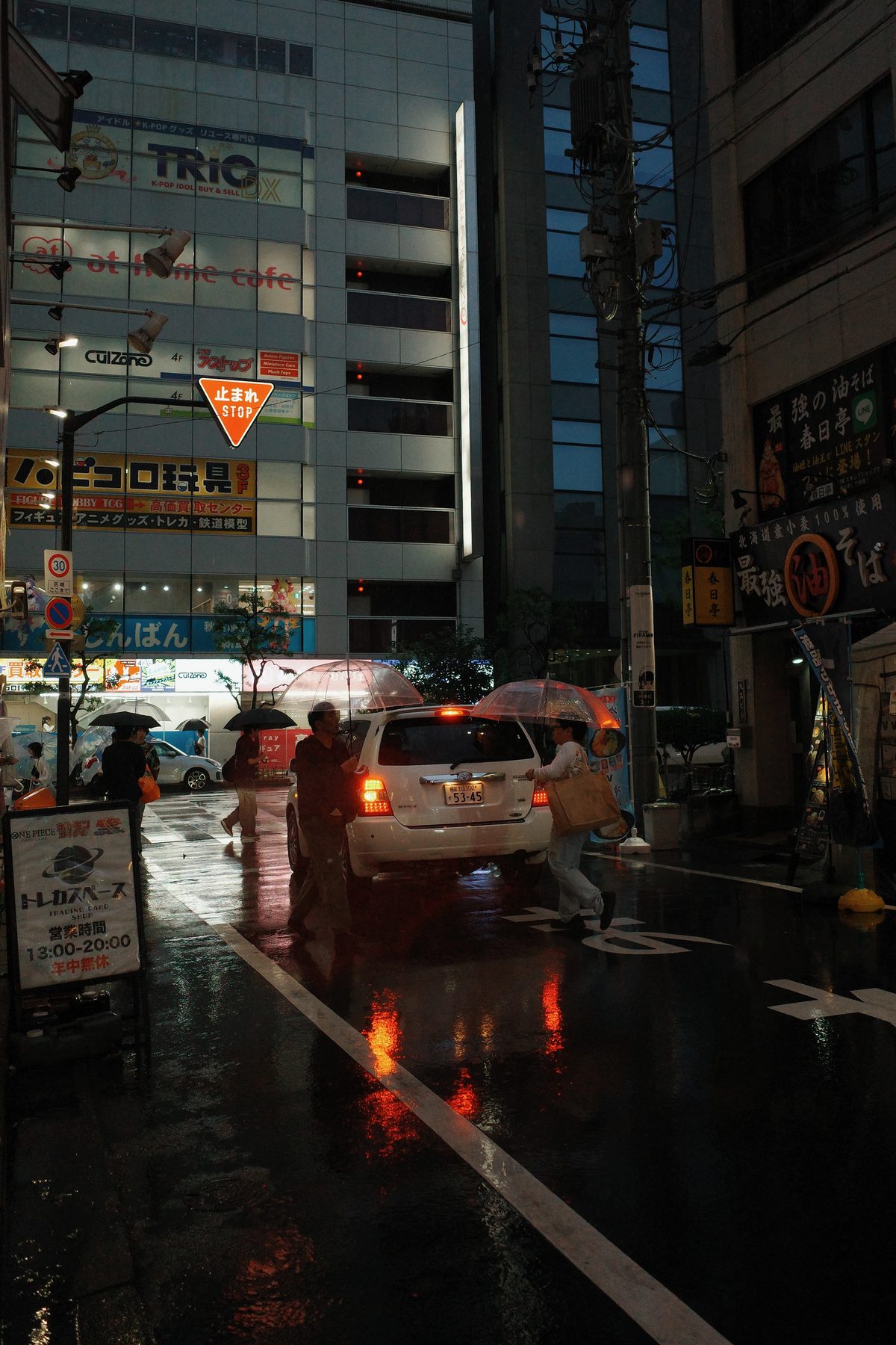 A taxi on a wet street