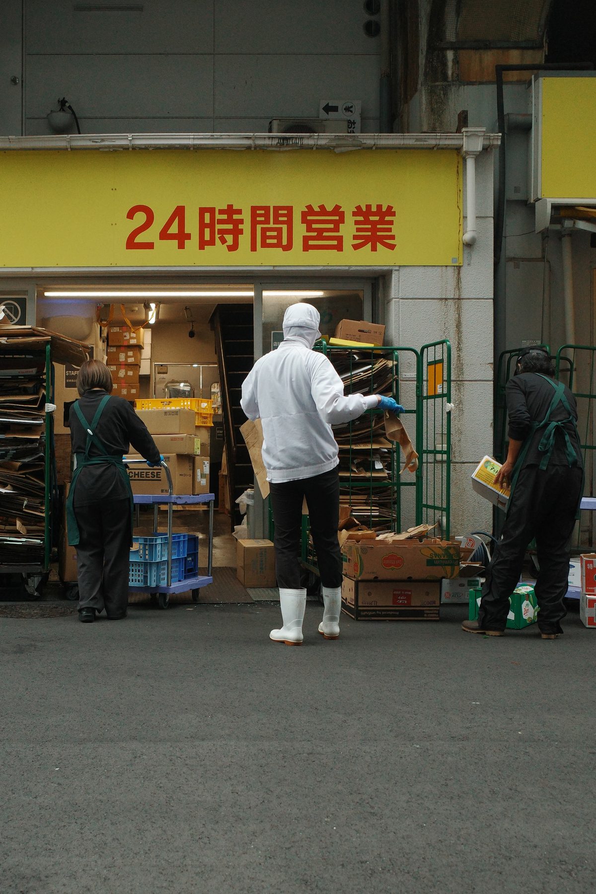 A delivery in front of a 24 hour shop