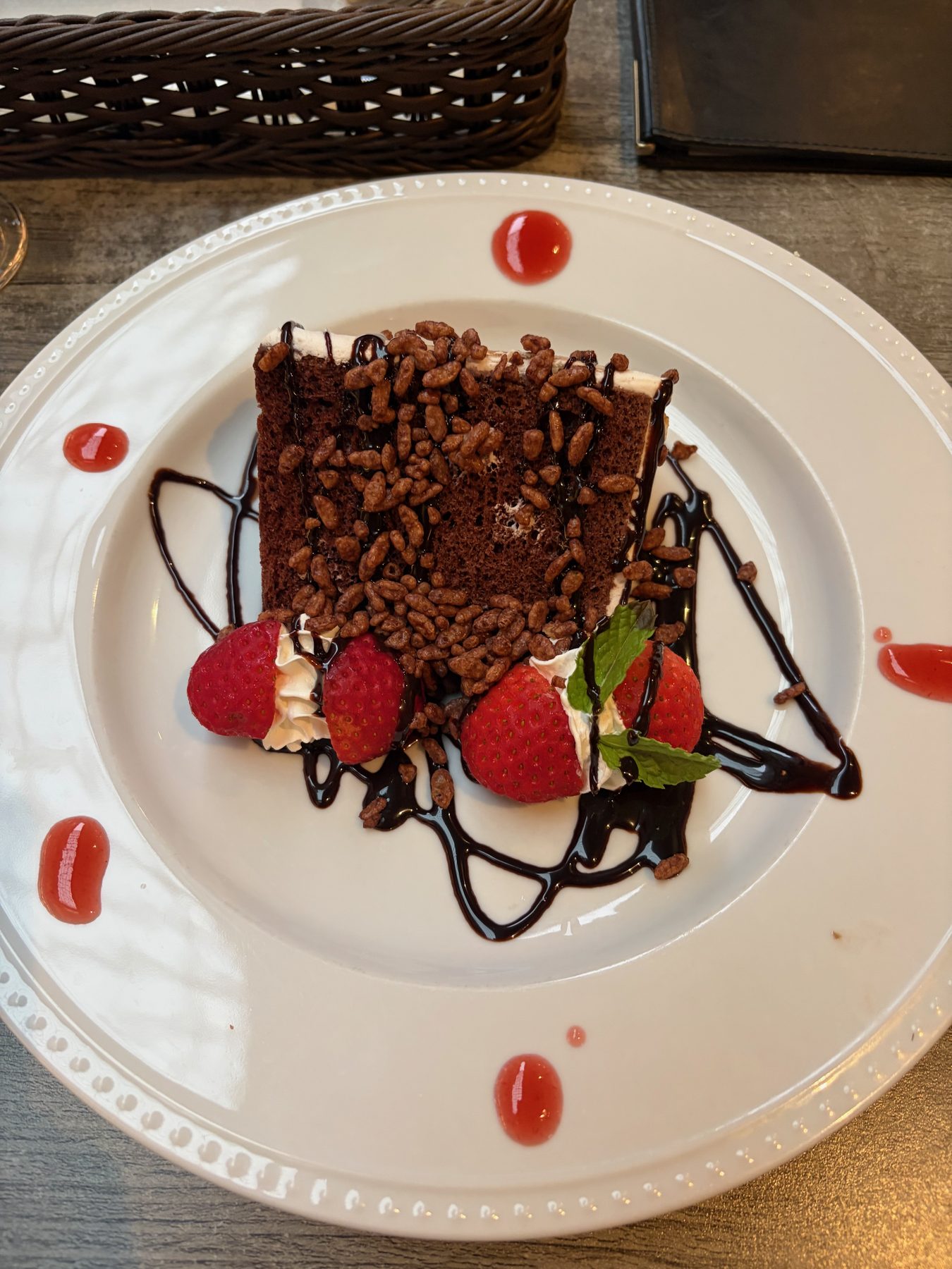 A chocolate dessert with strawberries