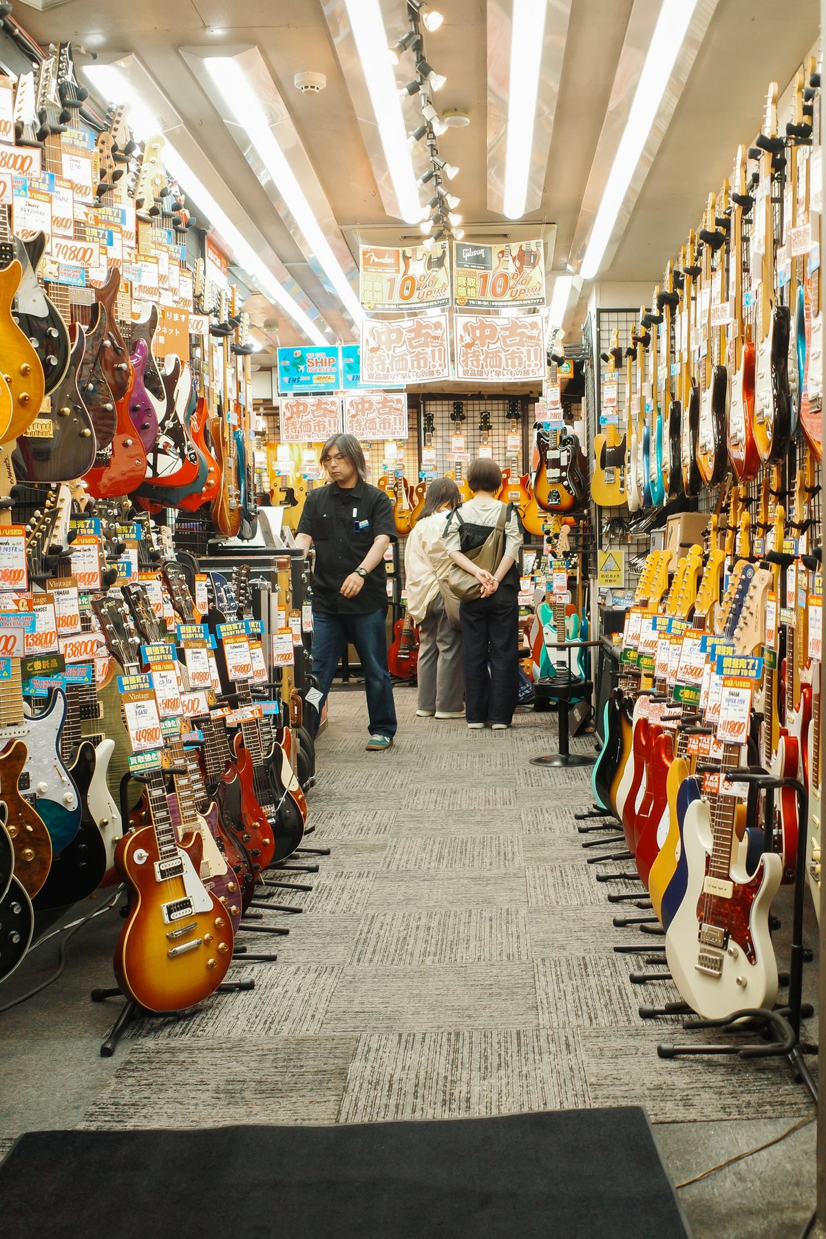 An aisle of electric guitars