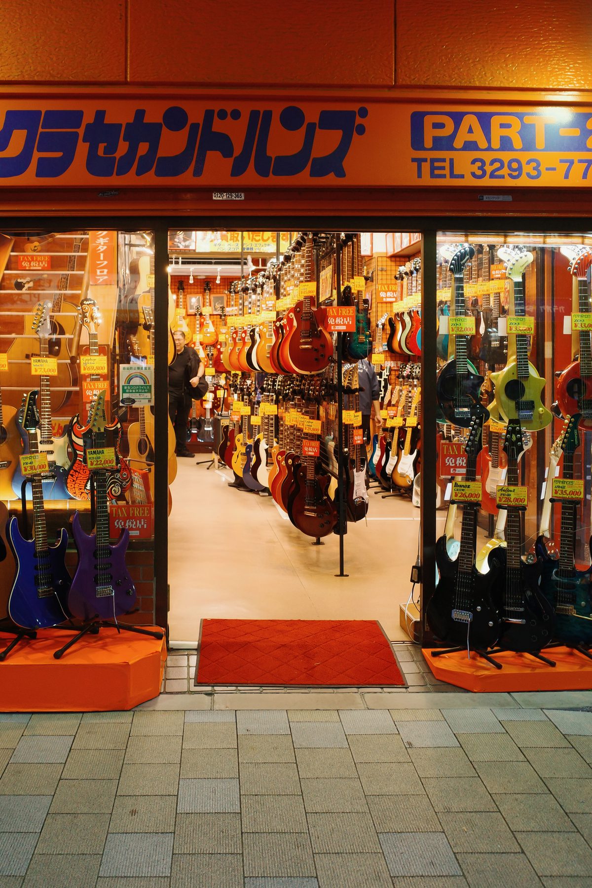 A guitar shop with a red carpet