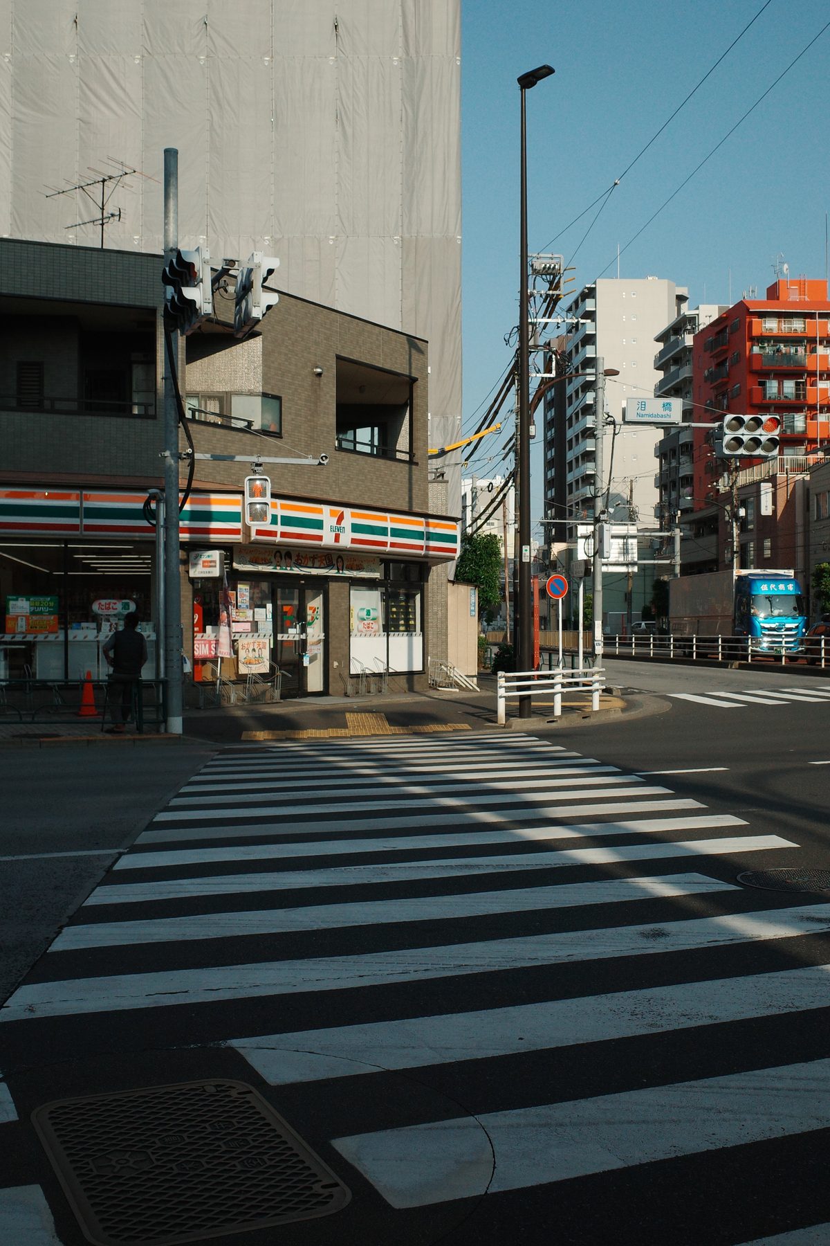 A pedestrian crossing at dawn