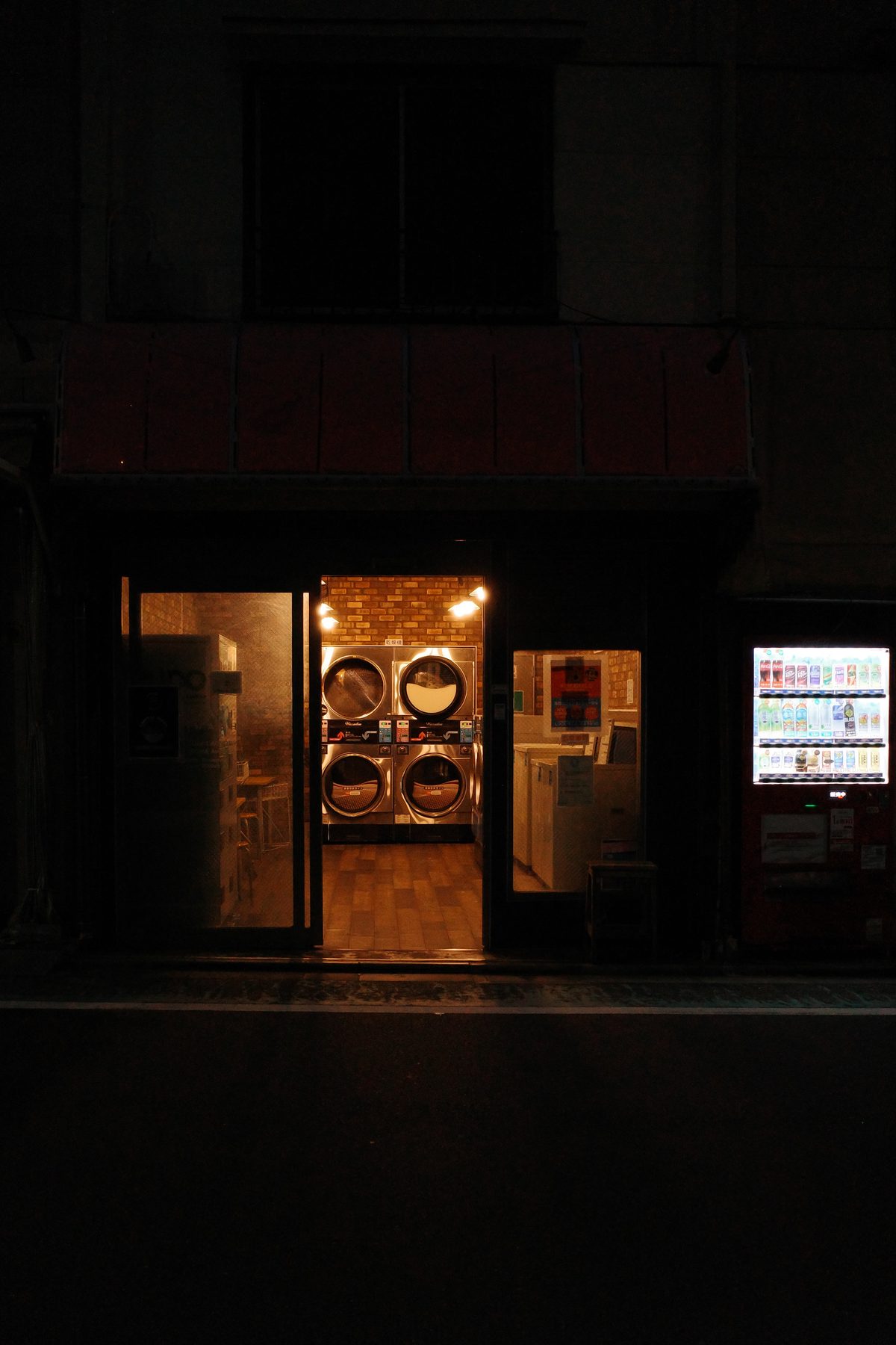 A laundromat lit up at night