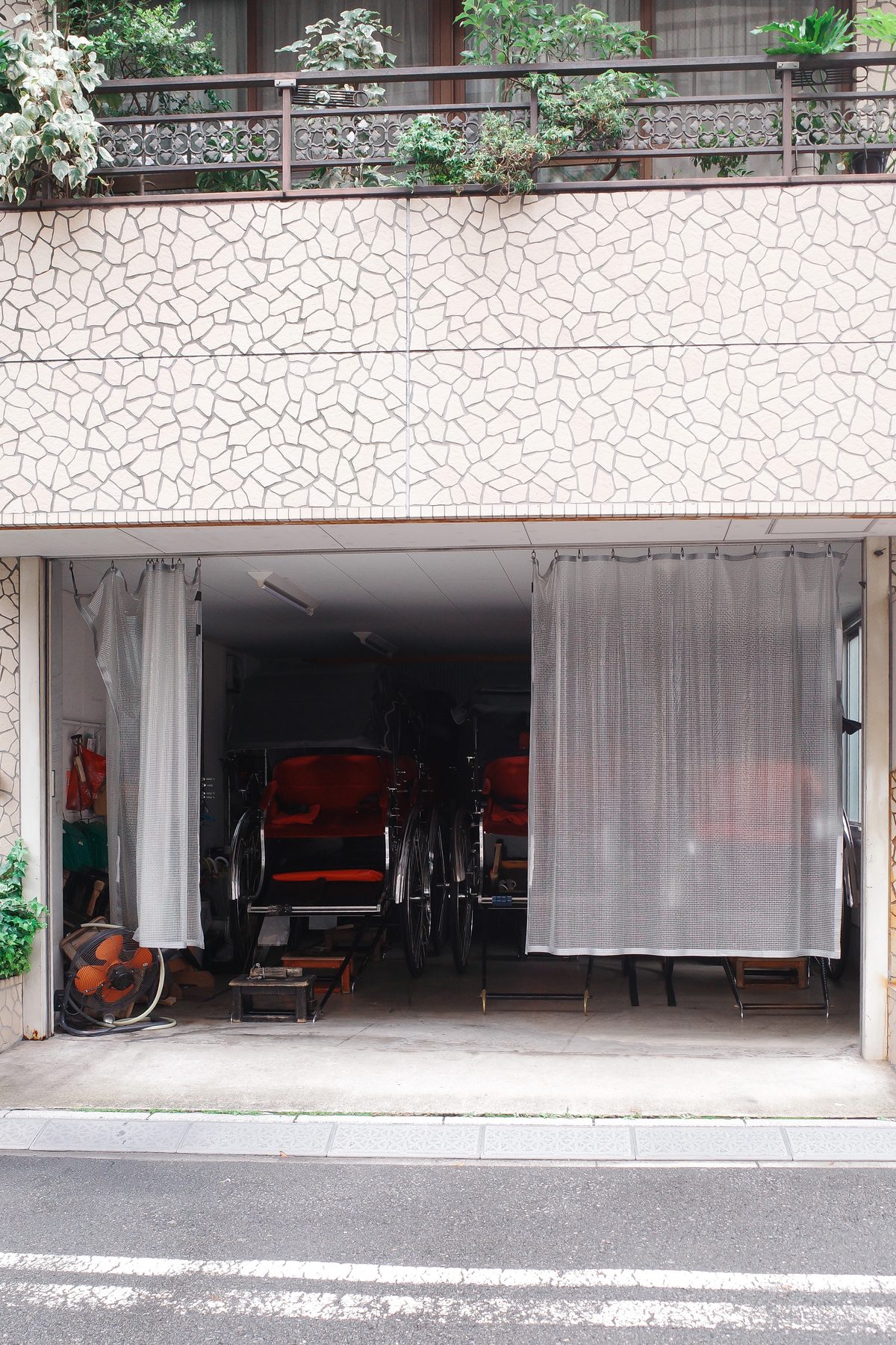 Rickshaws parked behind a curtain