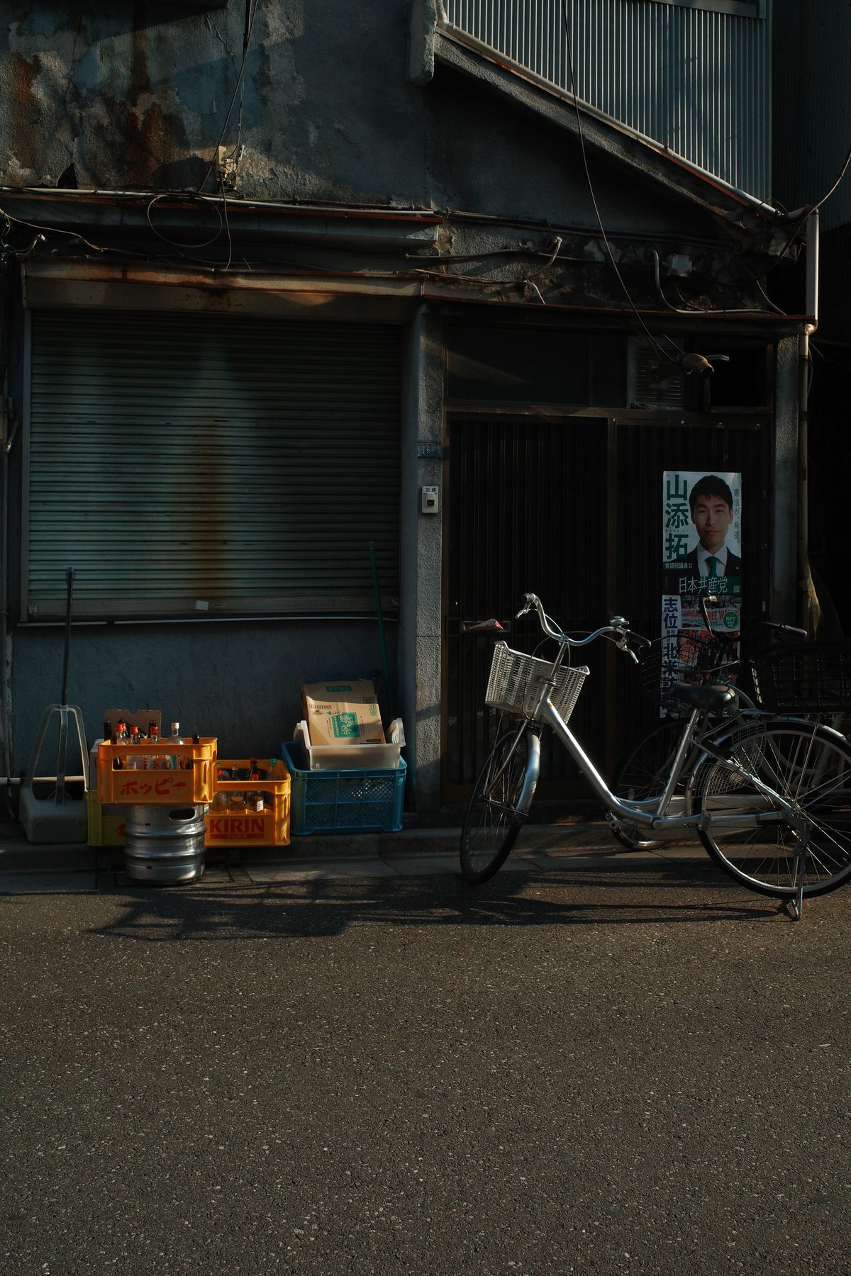 Bicycles in front of rusty shutters