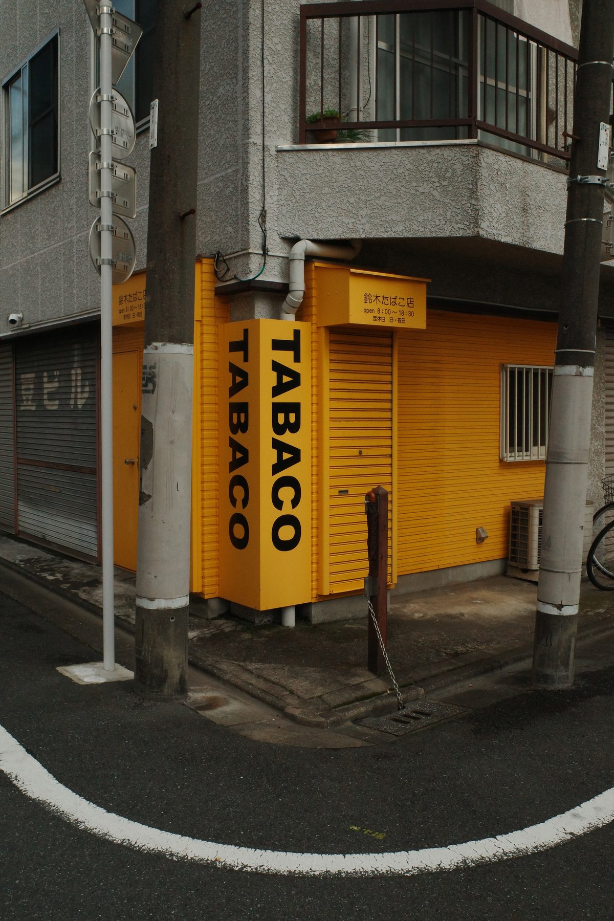 A yellow tobacco shop on a corner