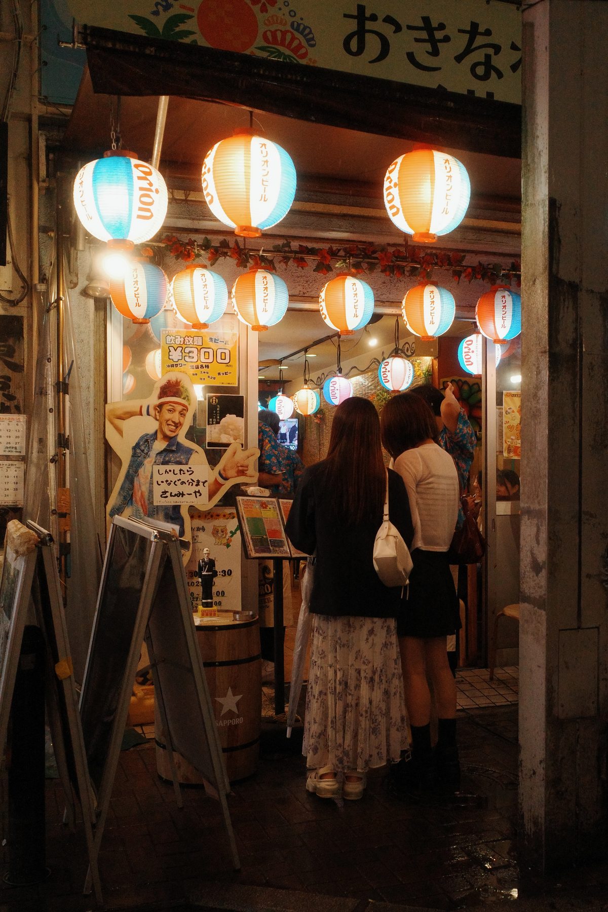 Customers under paper lanterns