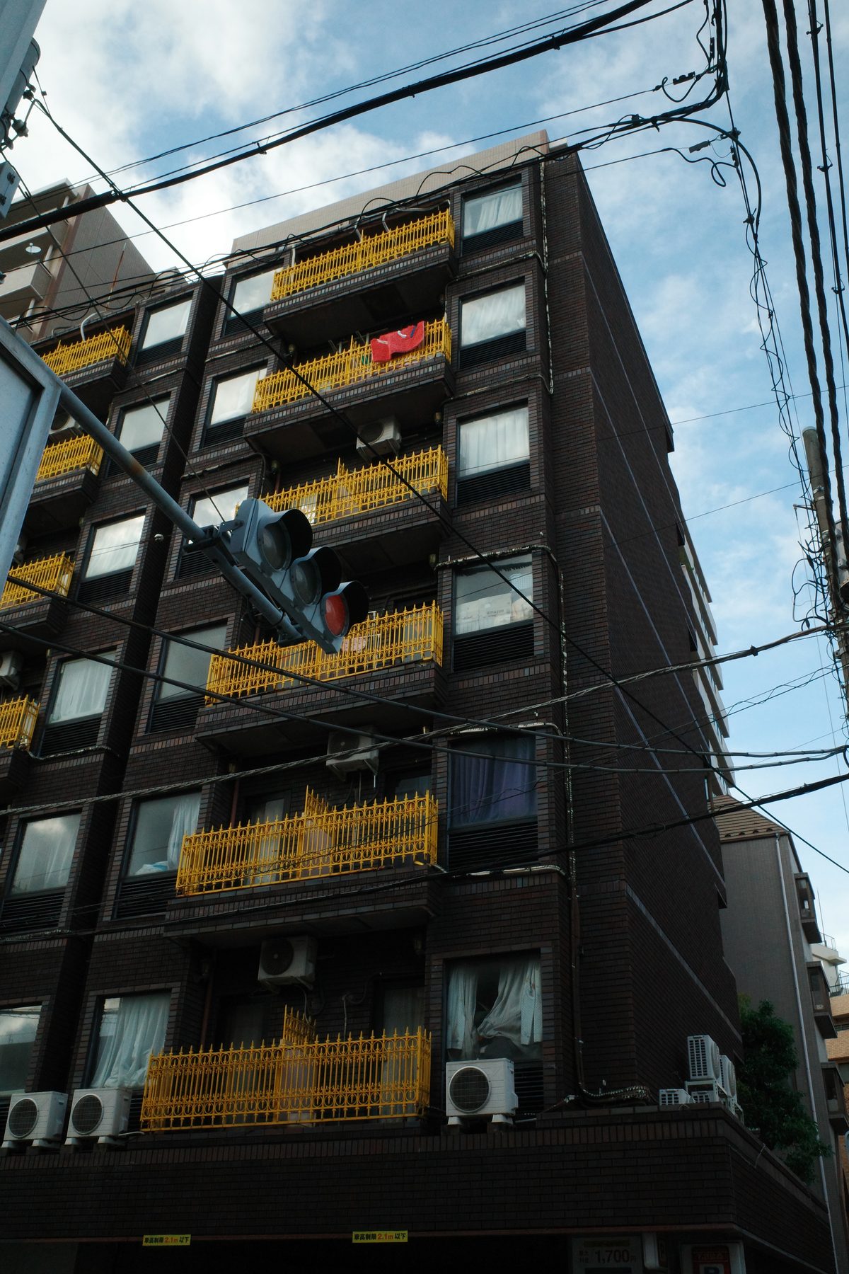 A building with yellow balconies