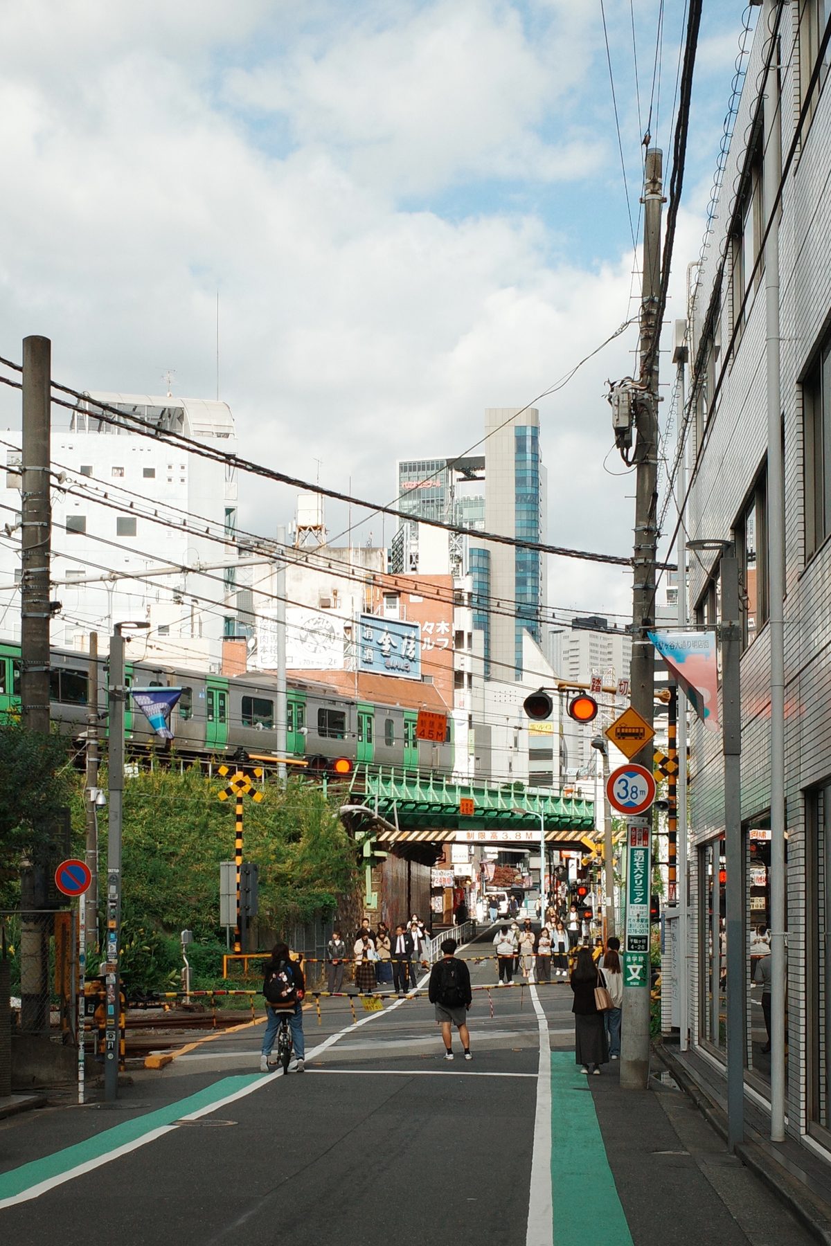 A street running under a railway bridge