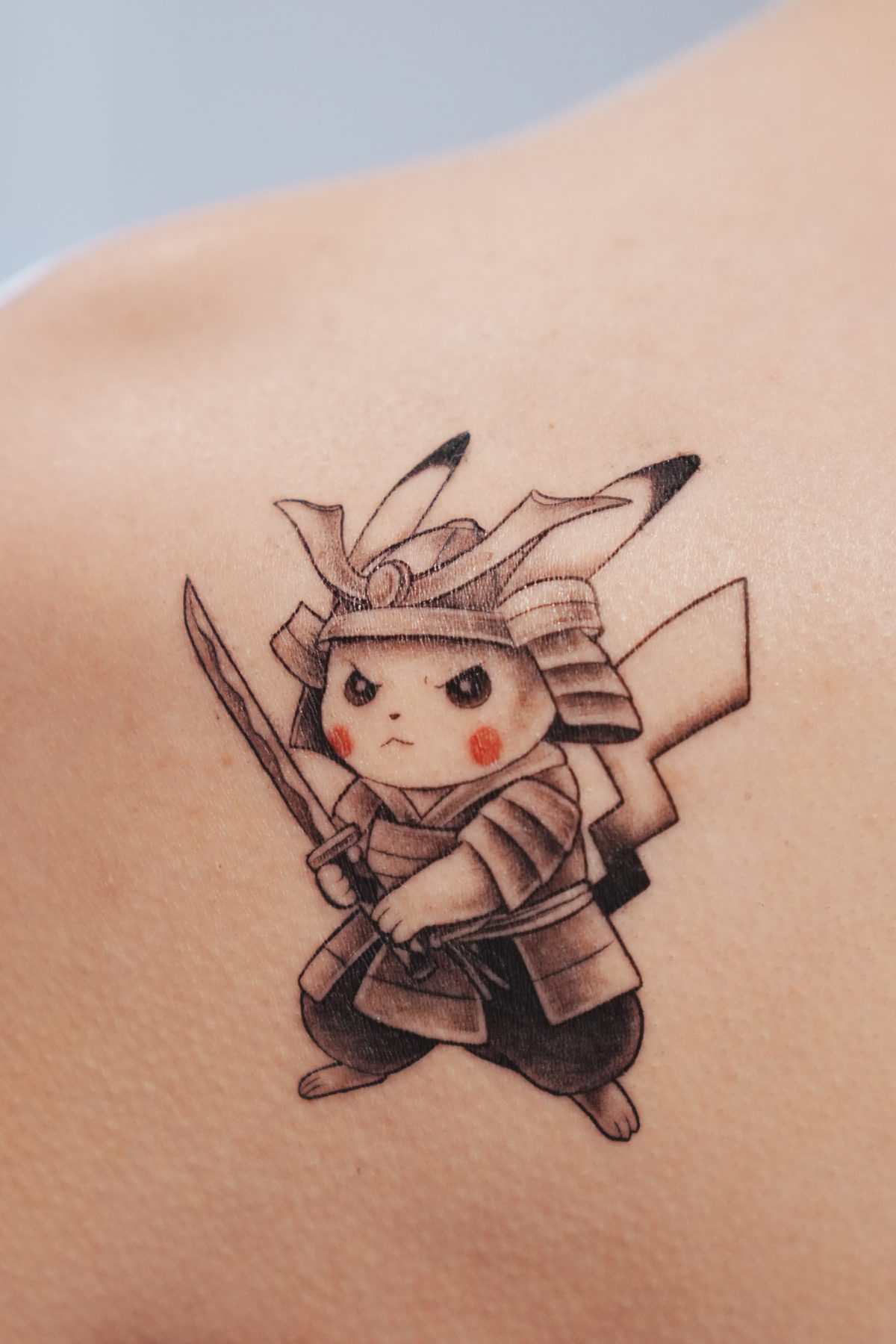 The finished tattoo: a samurai Pikachu