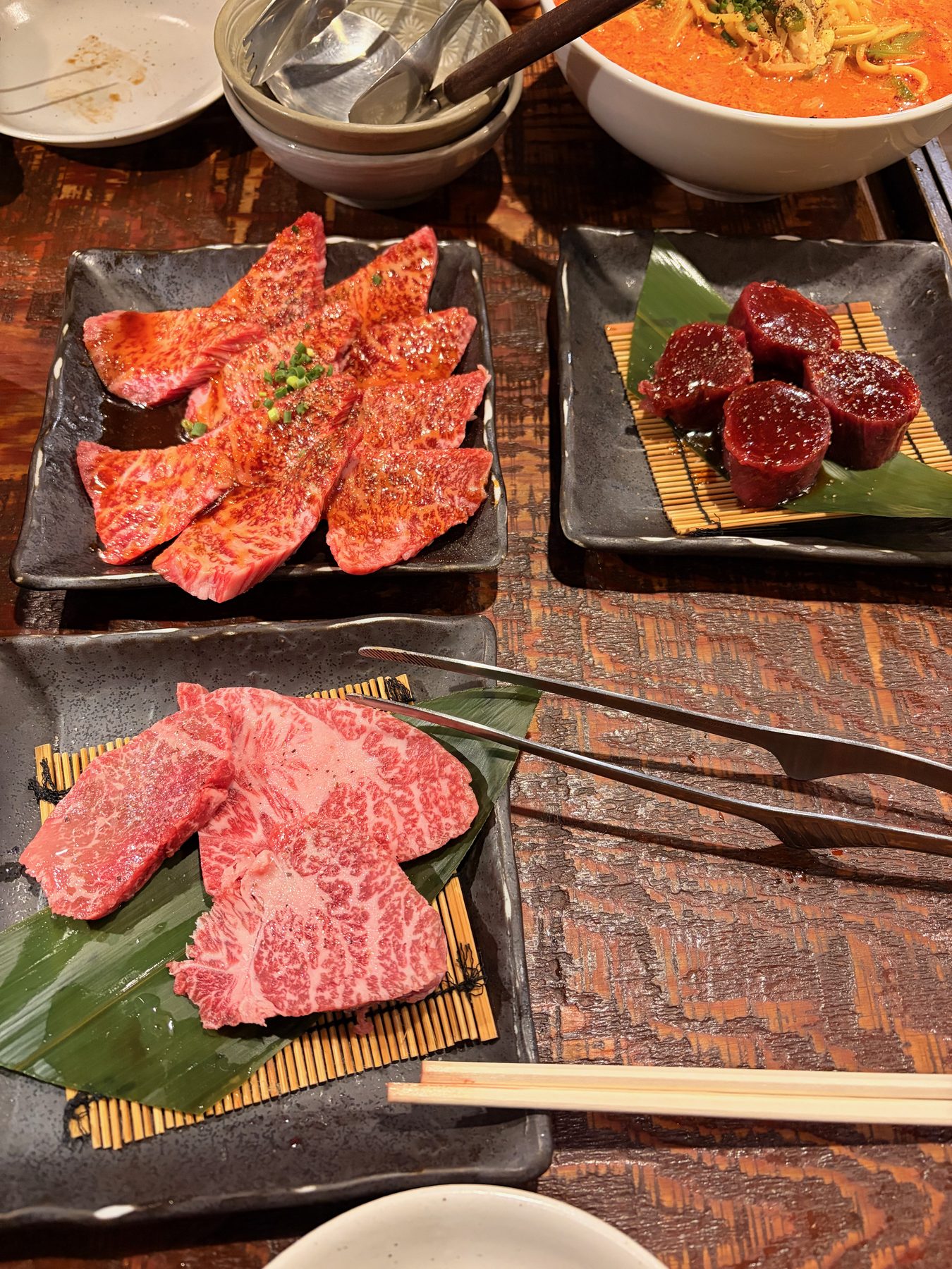 Plates of raw marbled beef for a yakiniku