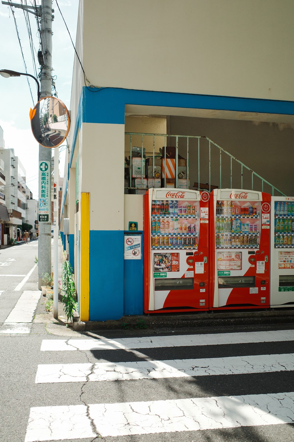 Vending machines on a blue and yellow corner