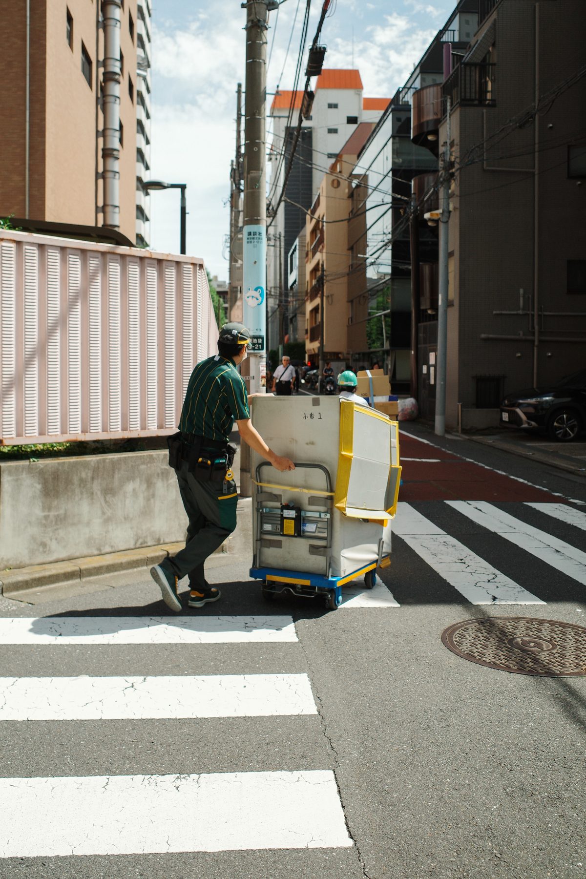 A delivery man with his cart