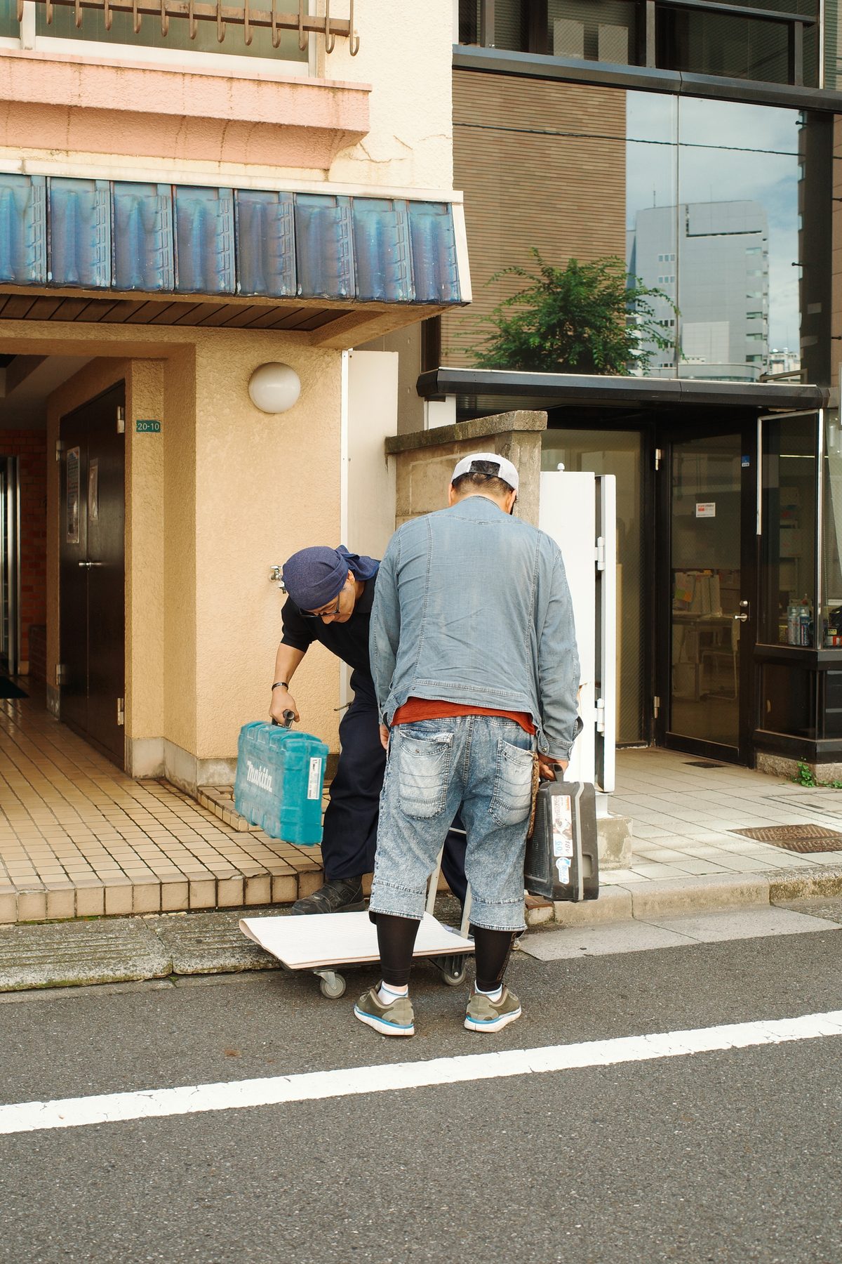 Two men unloading a delivery