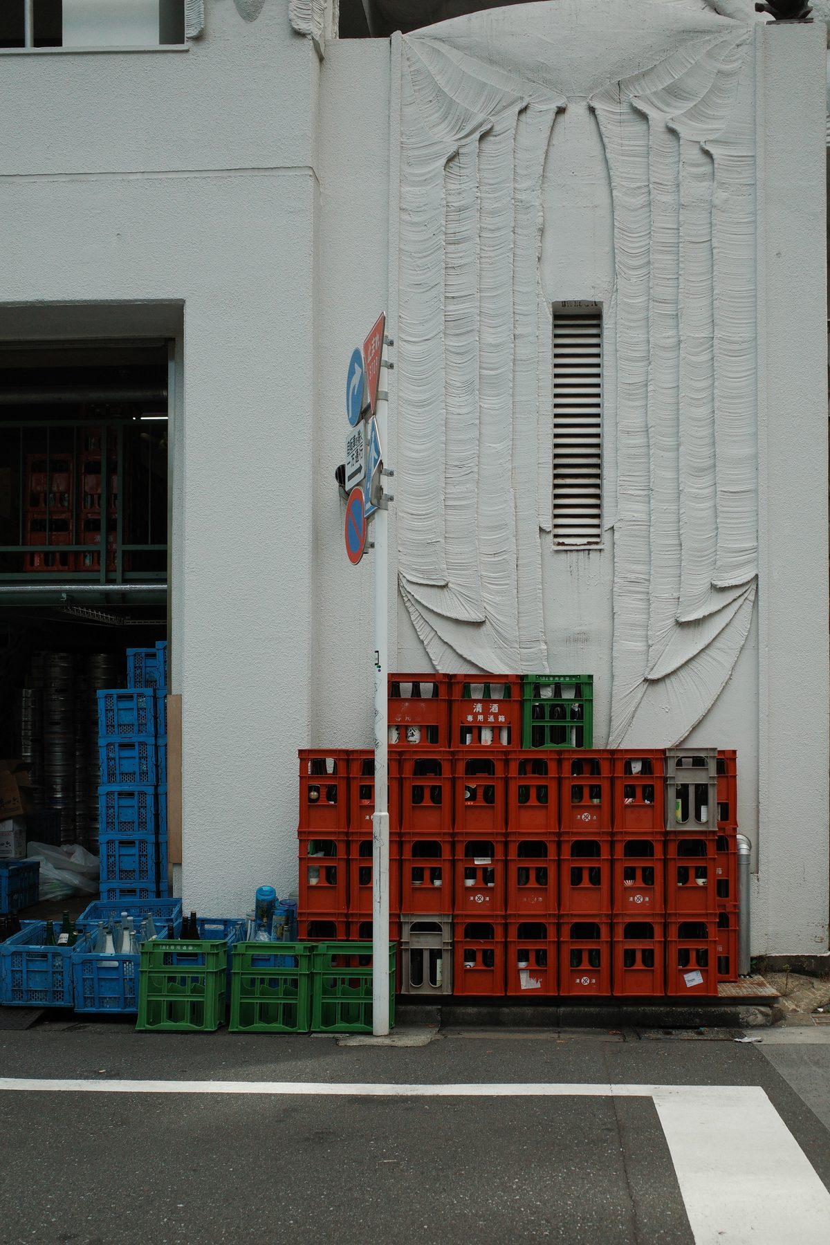 Red crates stacked in the street