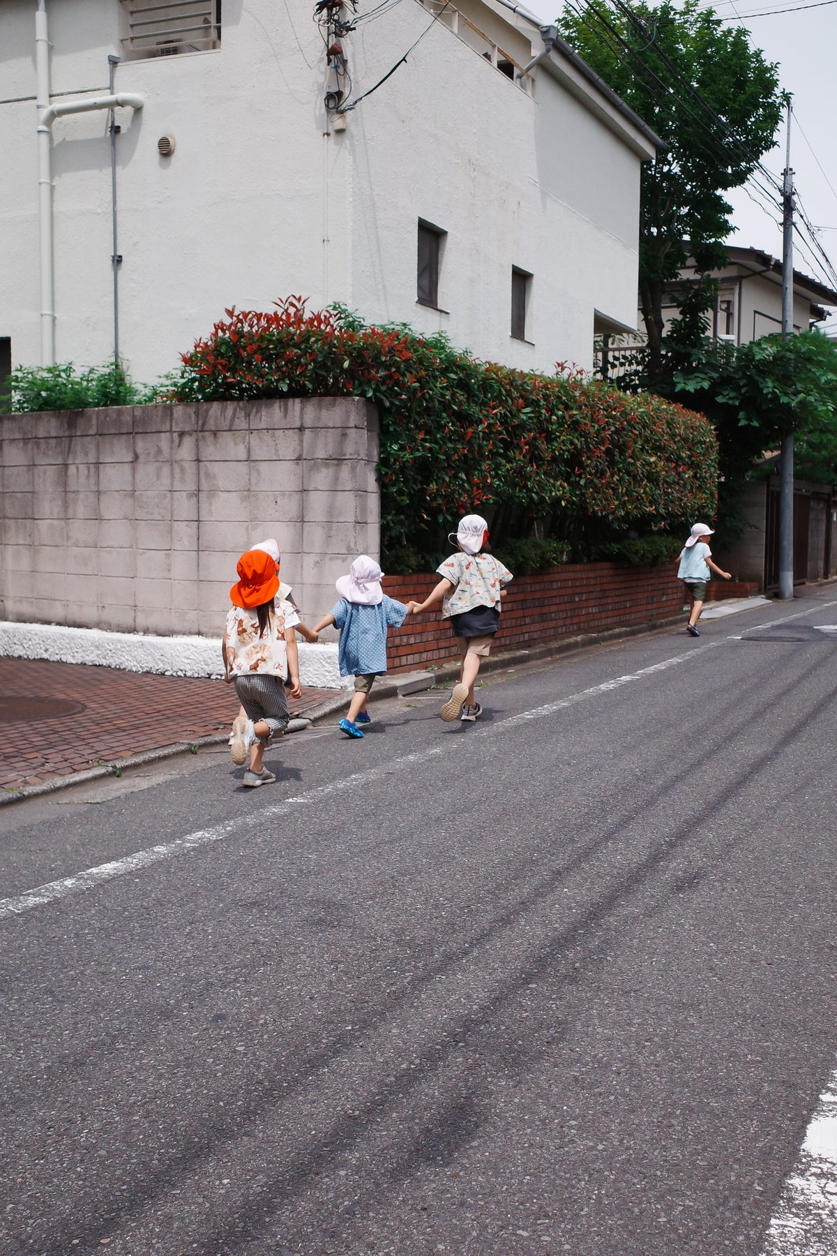 Children walking up a street
