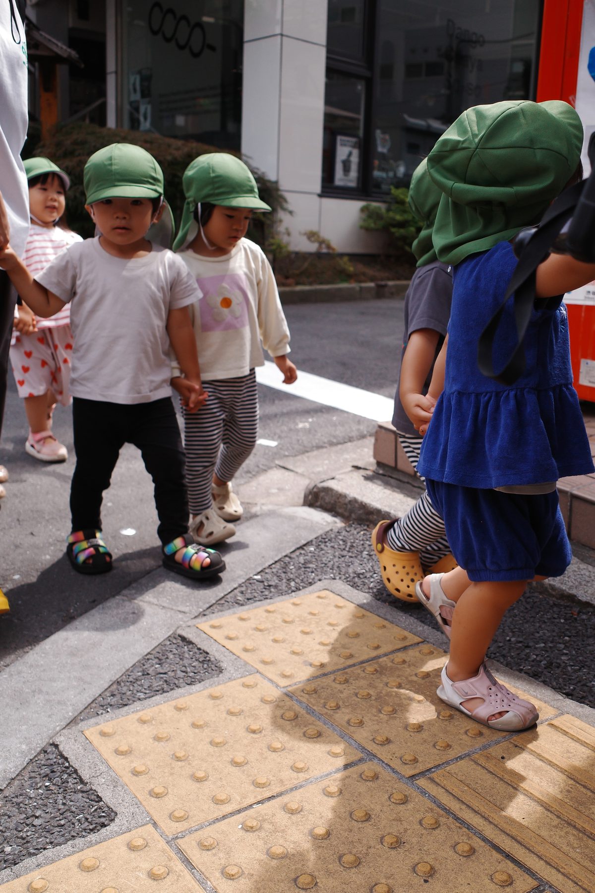Children in green hats