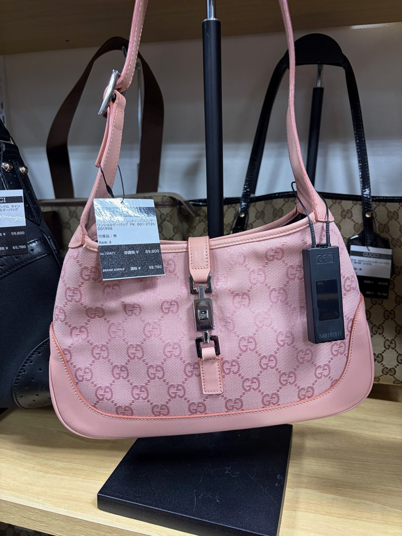 A pink Gucci Jackie bag