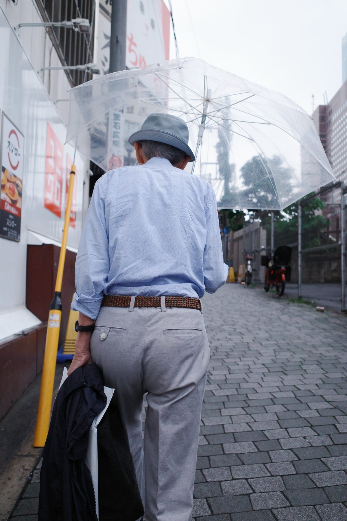 A man walking up a street in Kabukicho