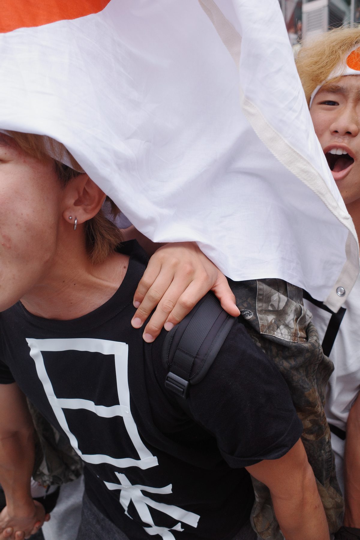 A fan under a Japanese flag