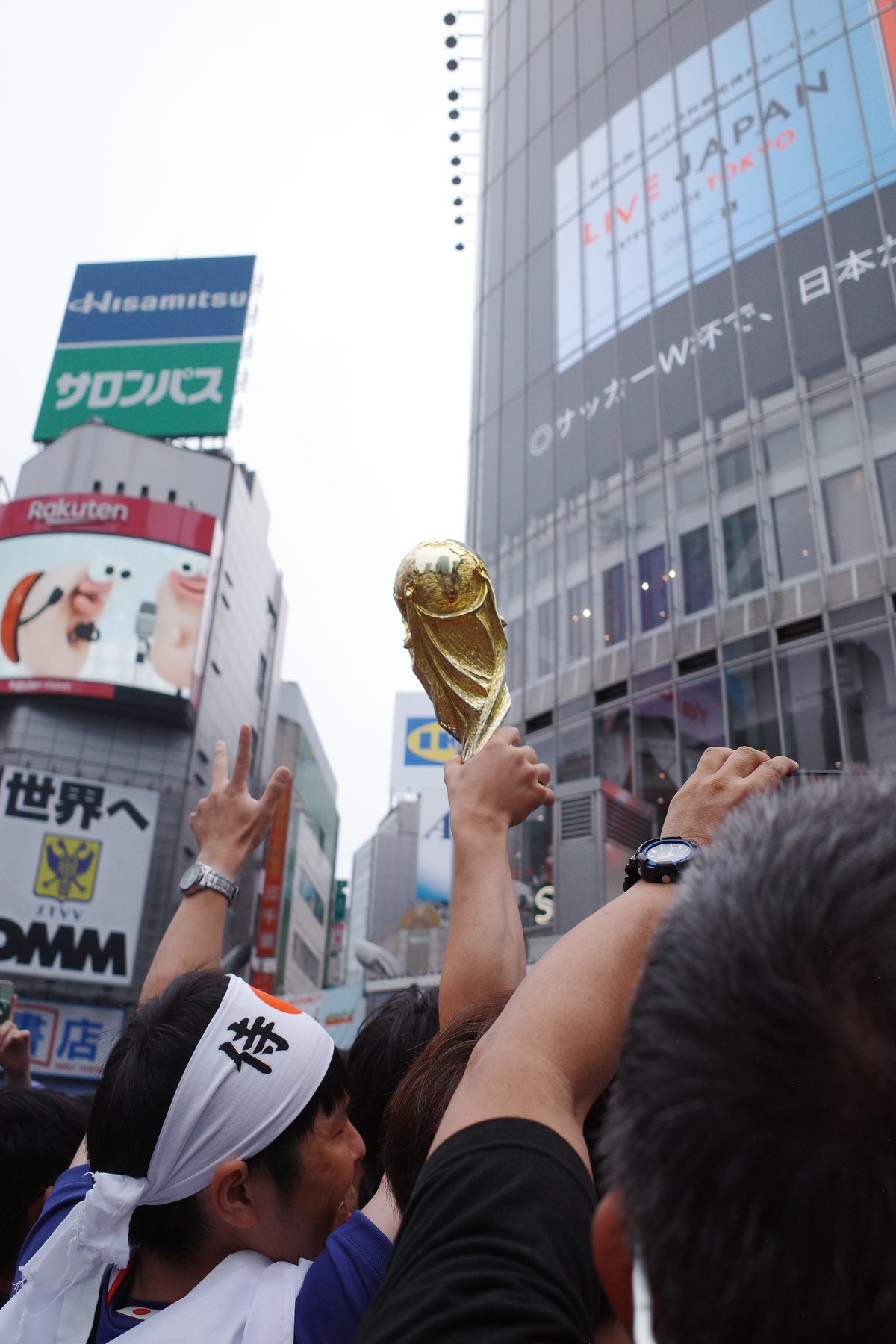 A replica trophy above the crowd