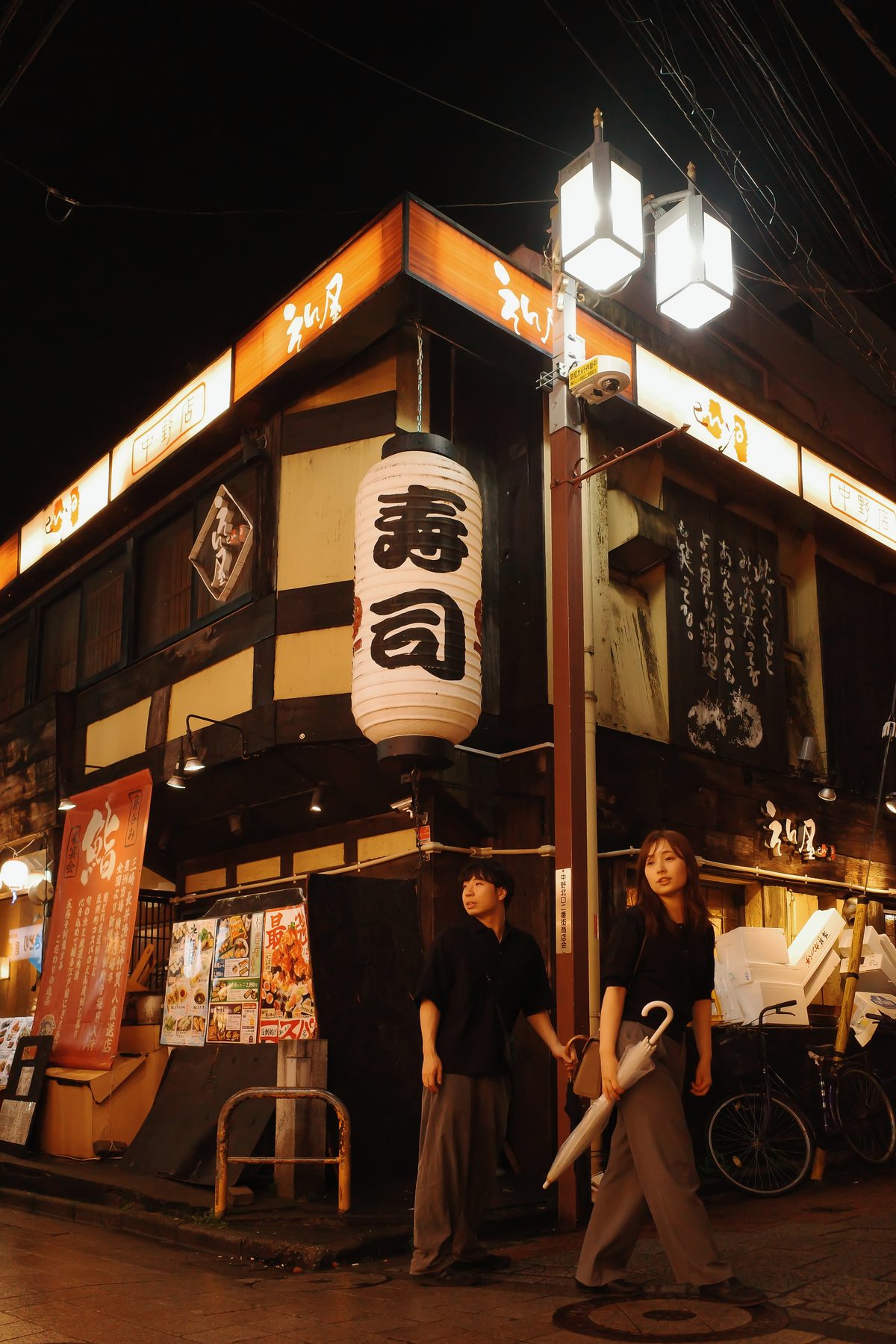 A sushi restaurant on a corner