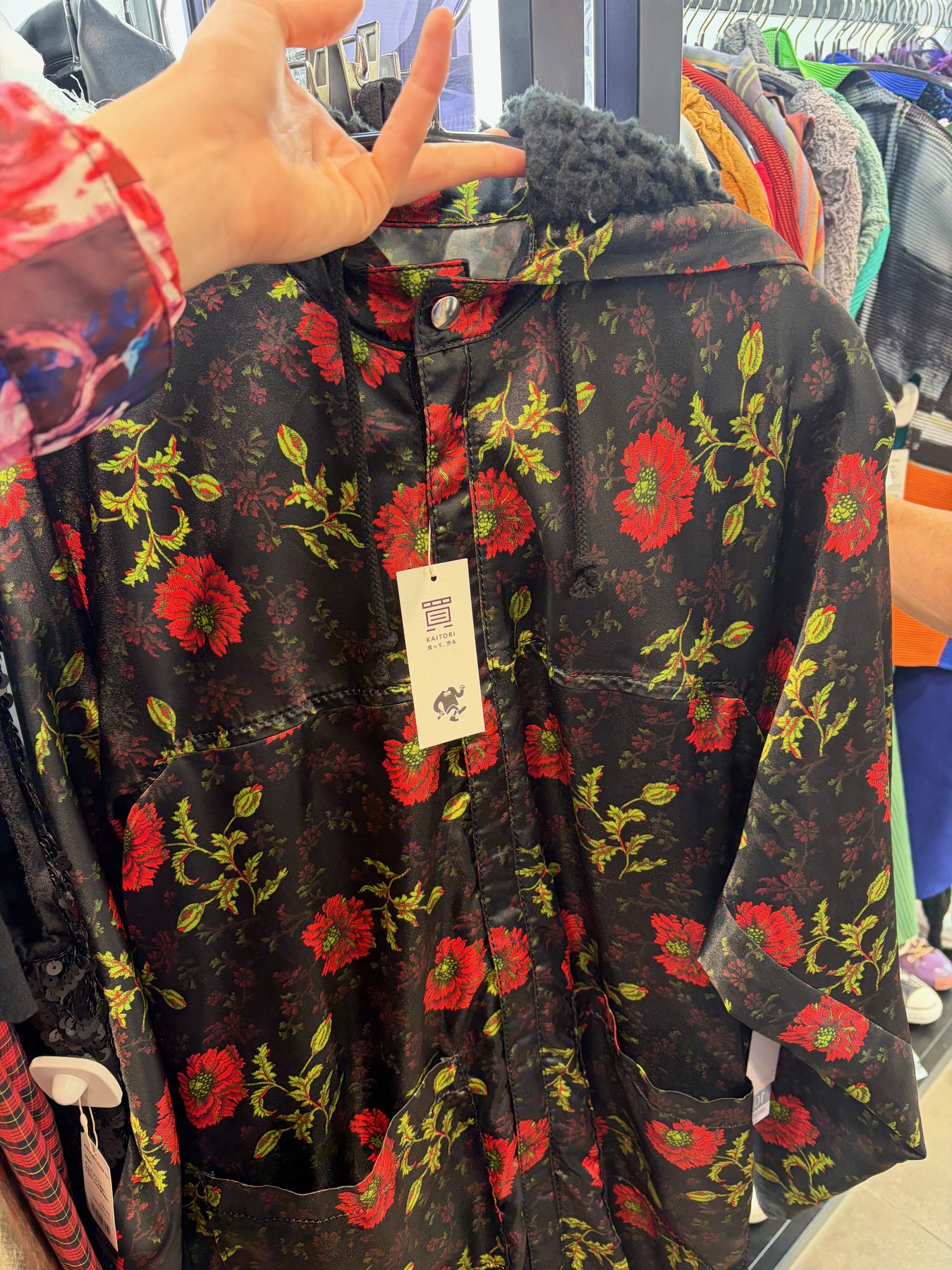 A black coat with red roses