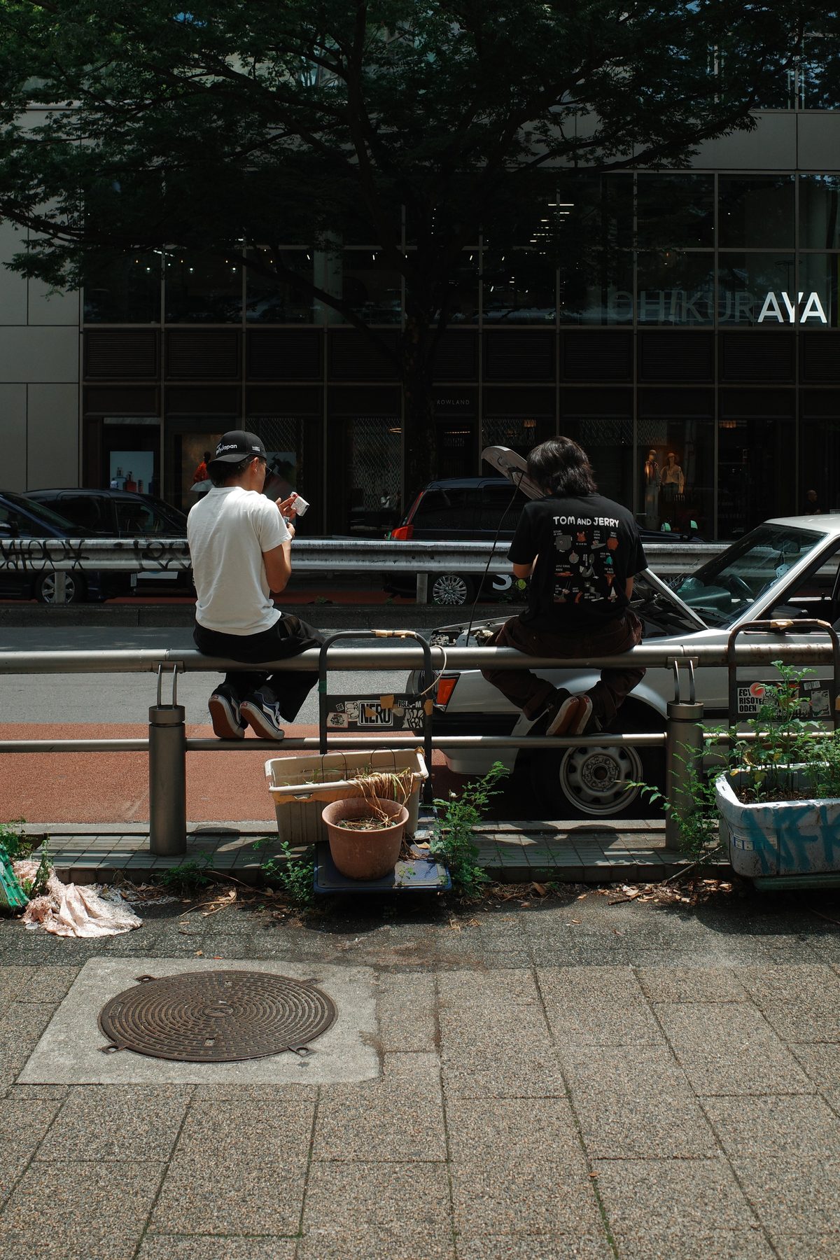 Two men taking a break by the road