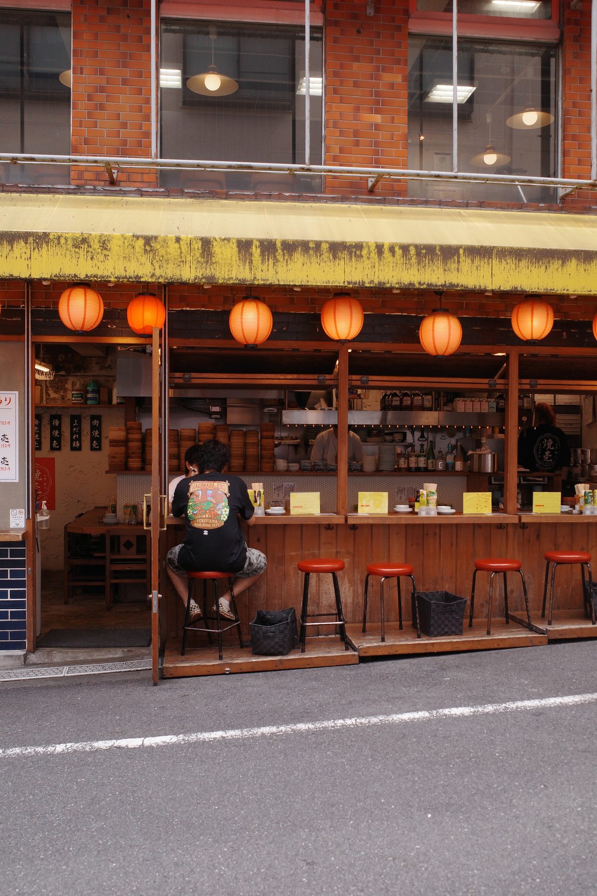 An izakaya with orange lanterns