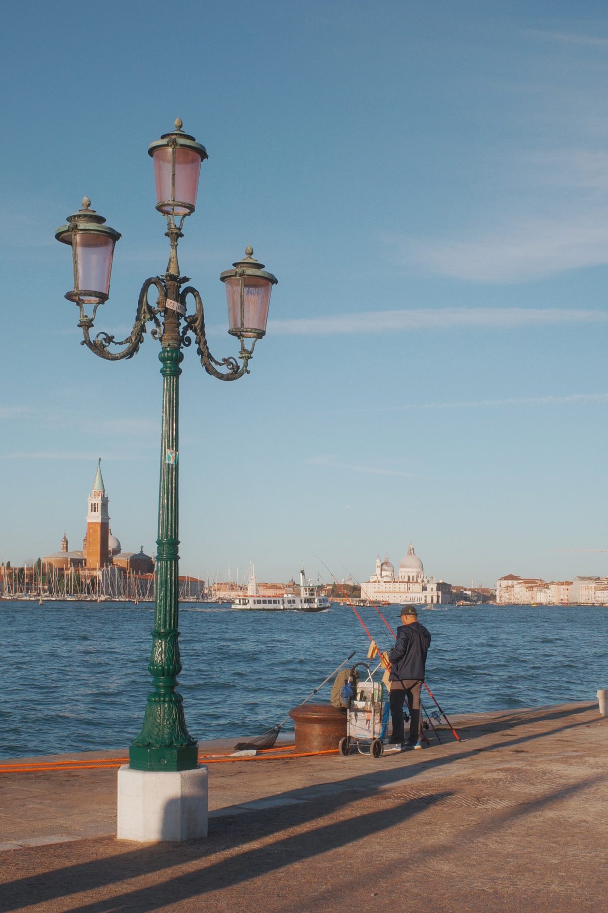 A lamppost on the lagoon at breakfast time