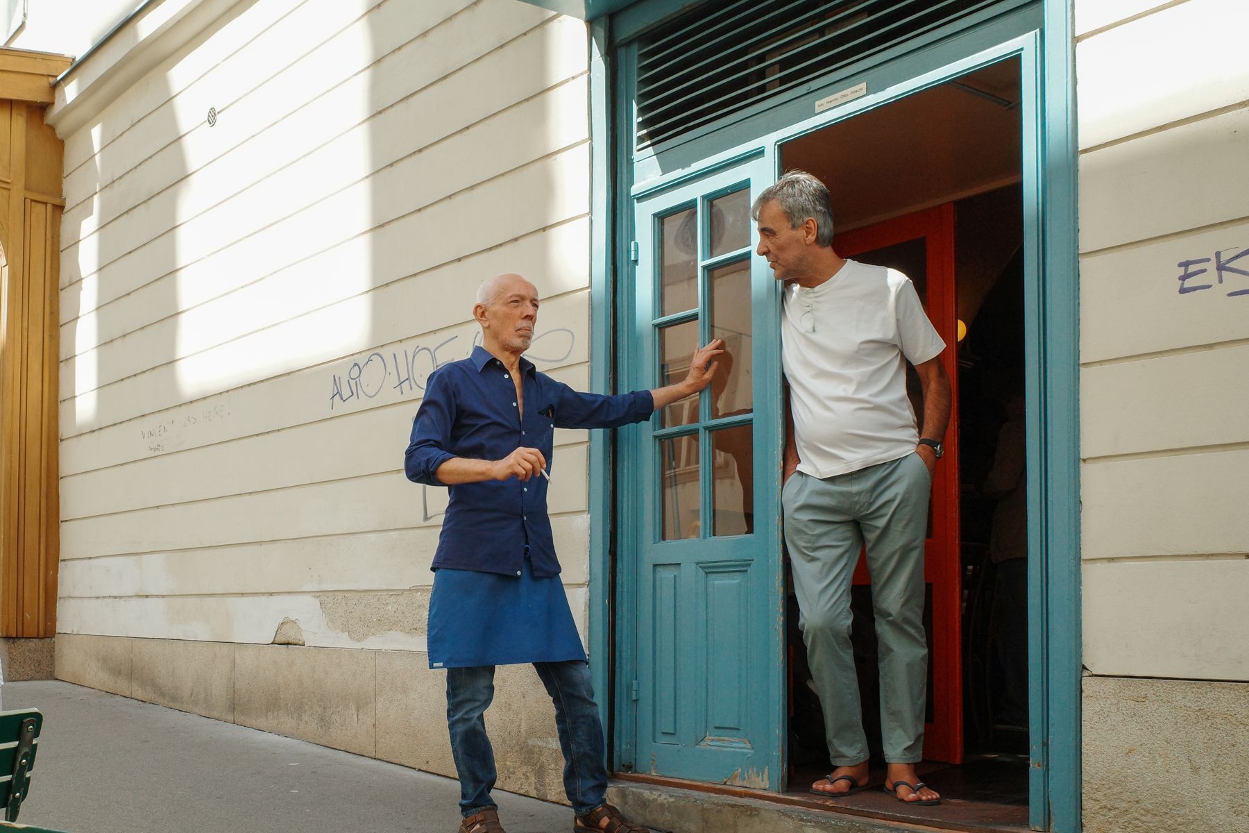 A conversation in a doorway